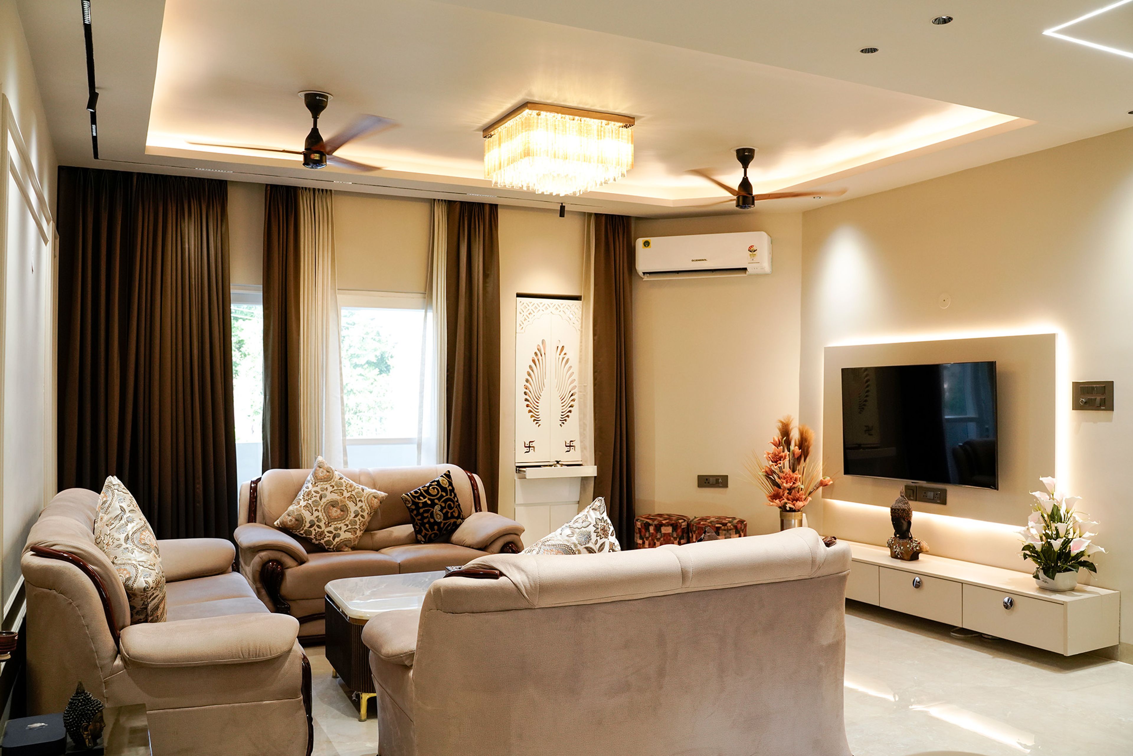 Living room design with beige sofas and TV unit