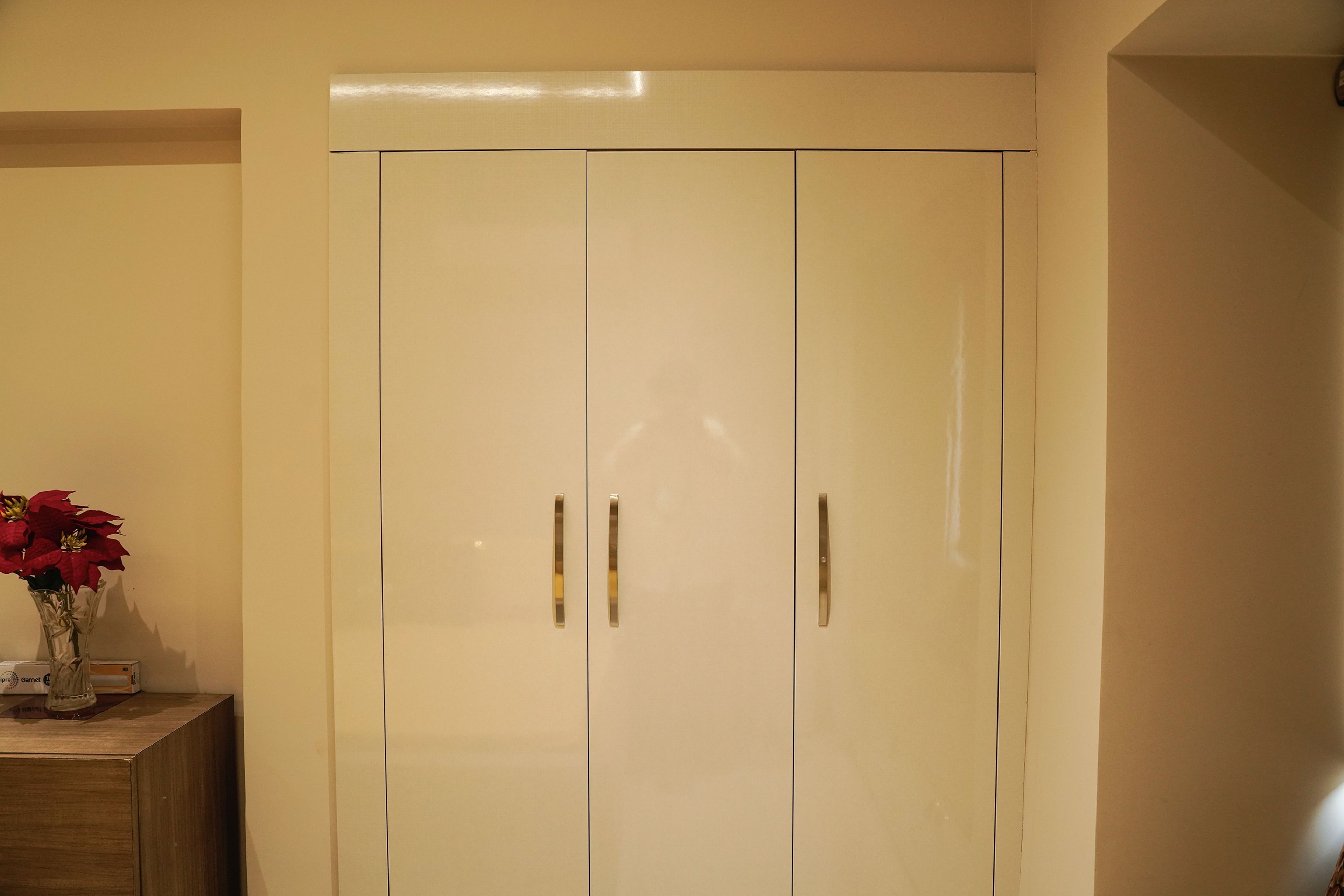 3-door cream swing wardrobe design