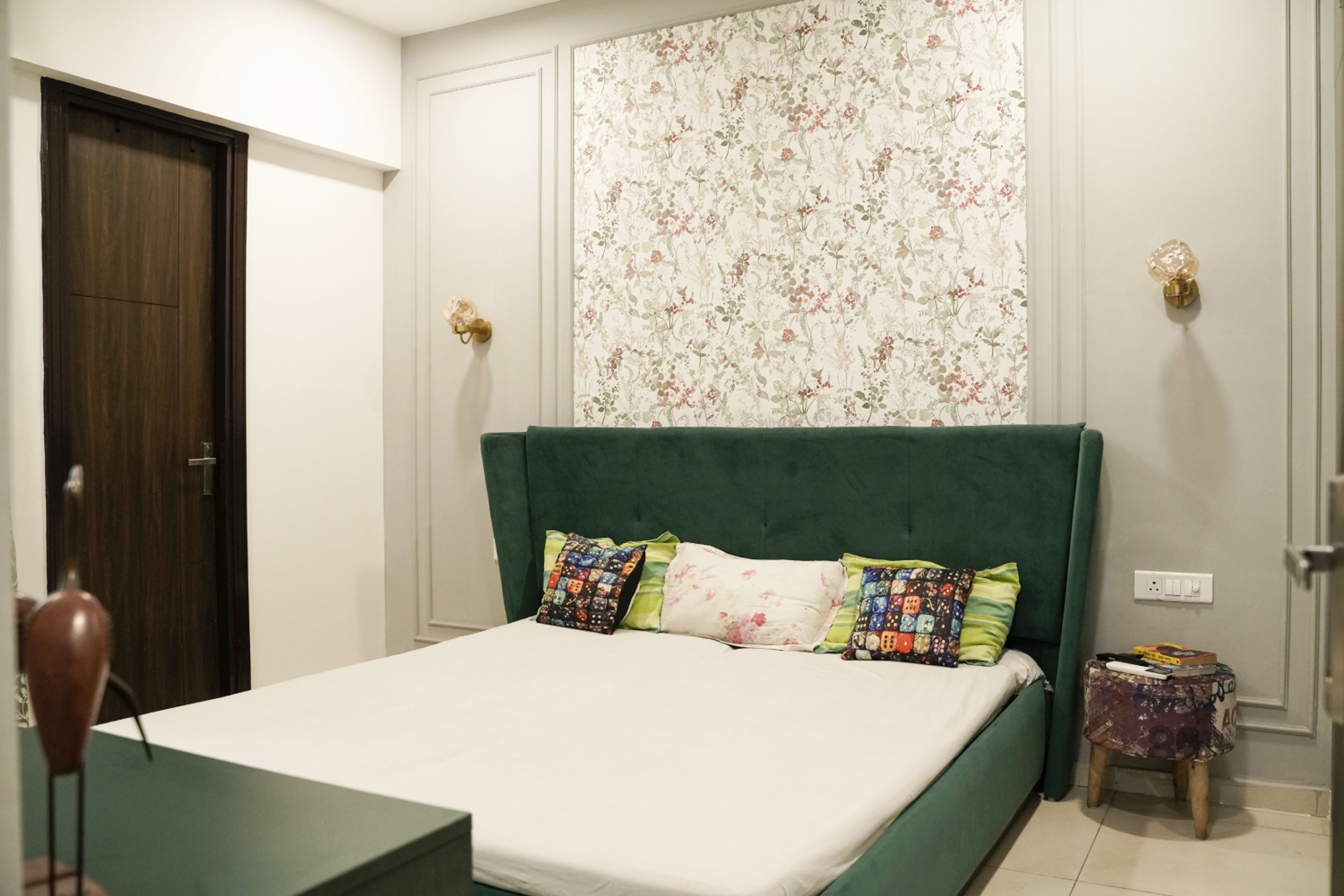 Bedroom Design with Green Velvet Headboard Bed, Floral Pattern Wallpaper and Cream Wall with Trims
