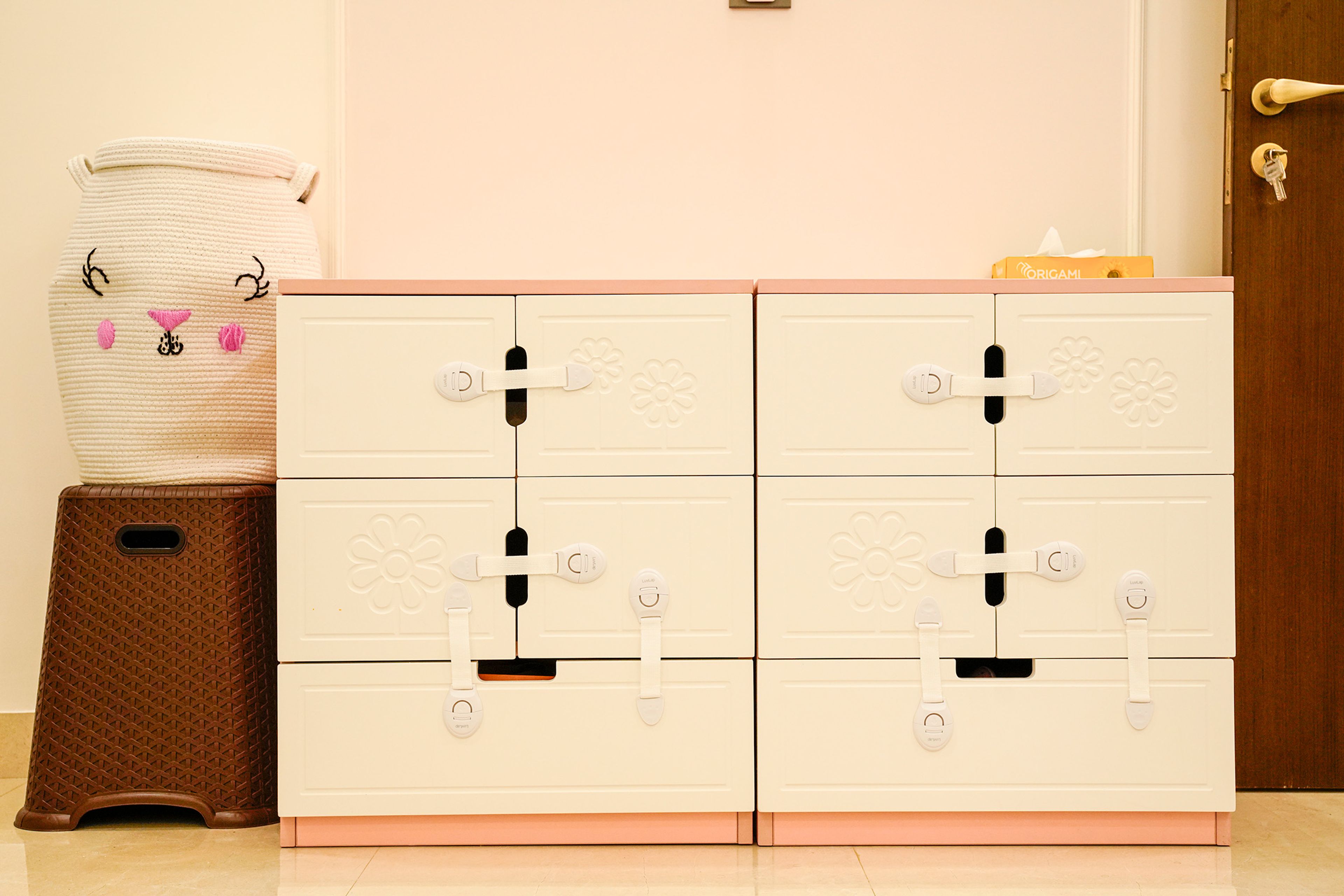 White Drawer Cabinets Featuring Floral Patterns and Safety Locks