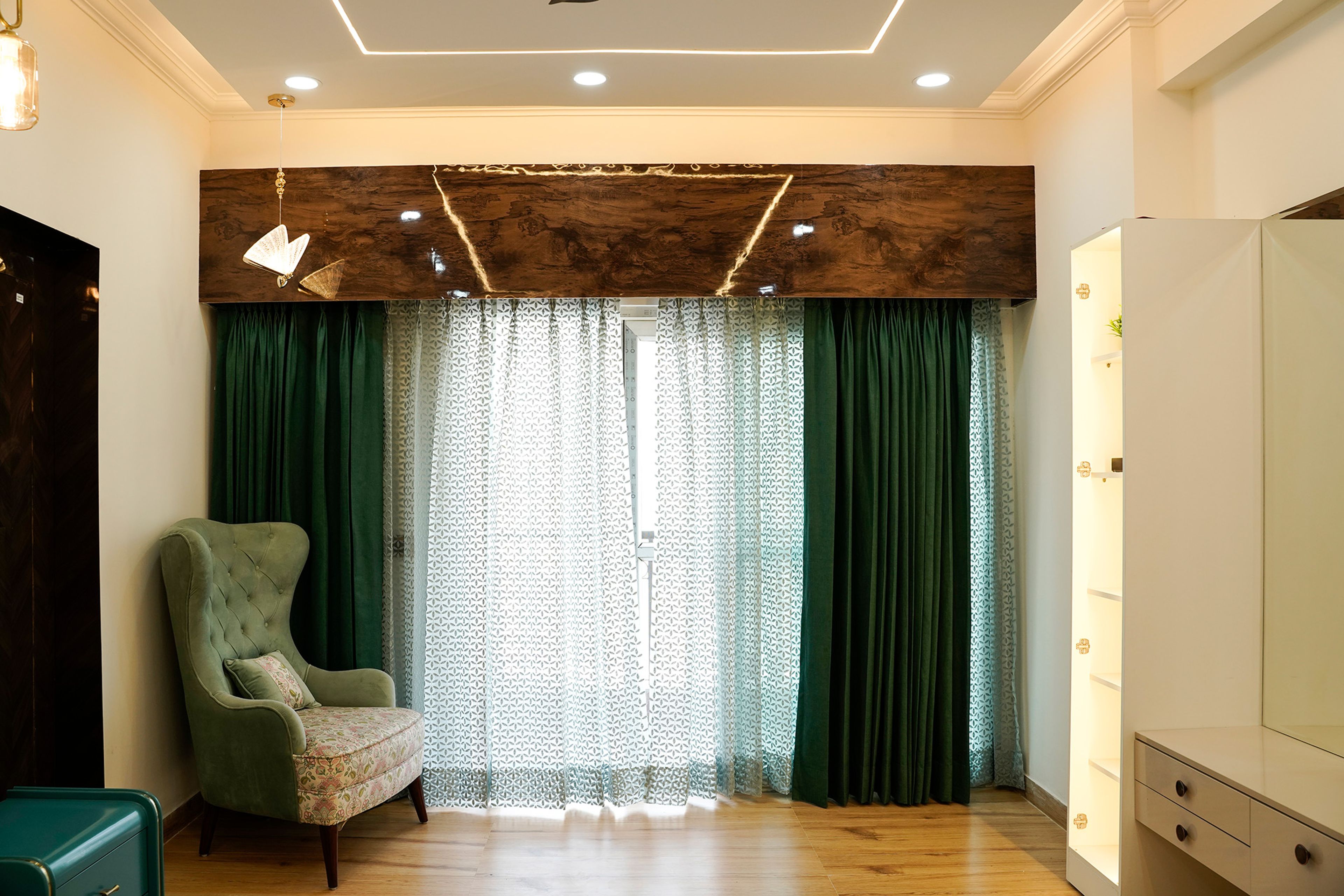 Living room design with green accent chair