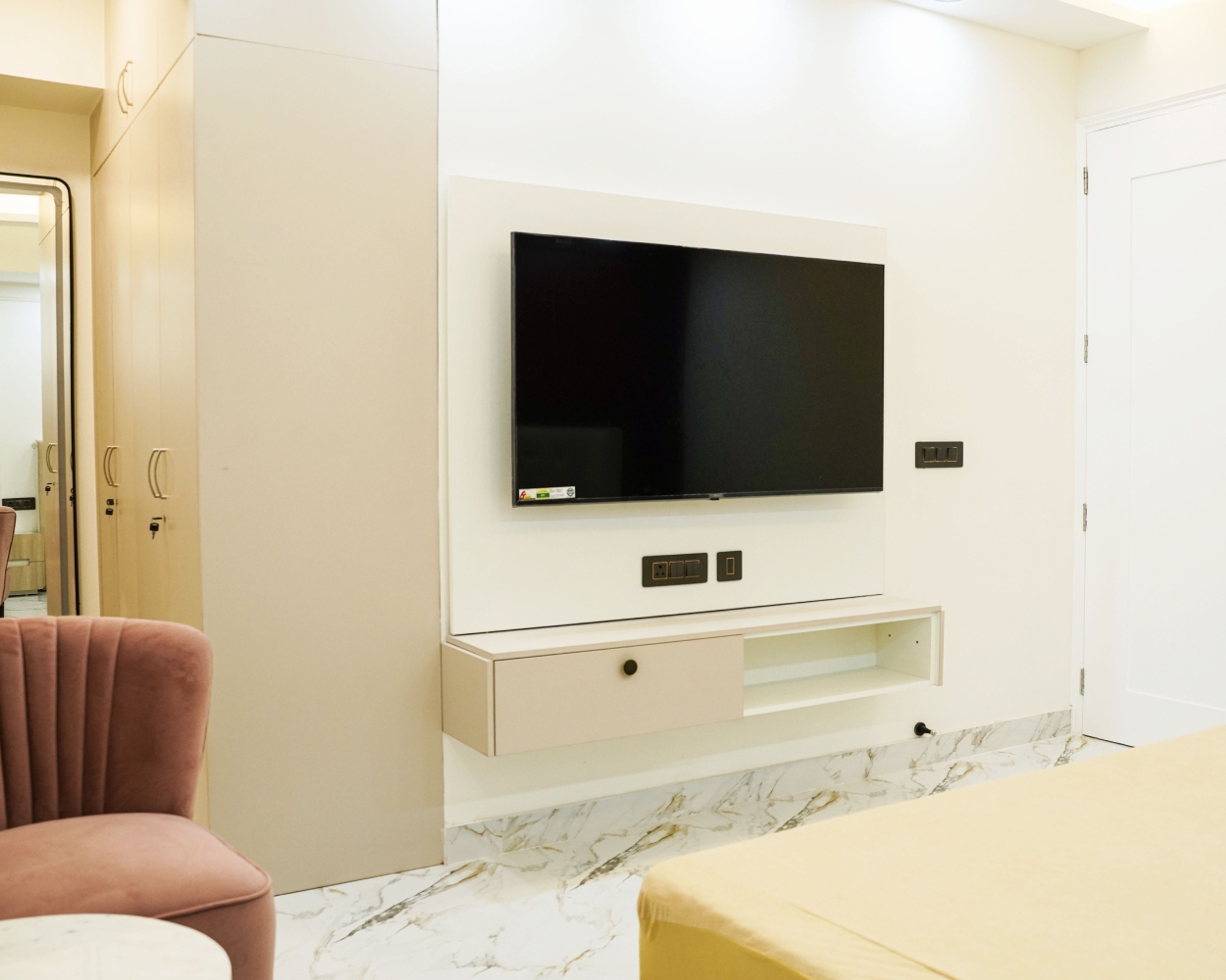 TV Unit Design with Beige Wall Panel, Floating Drawer, and Mounted TV