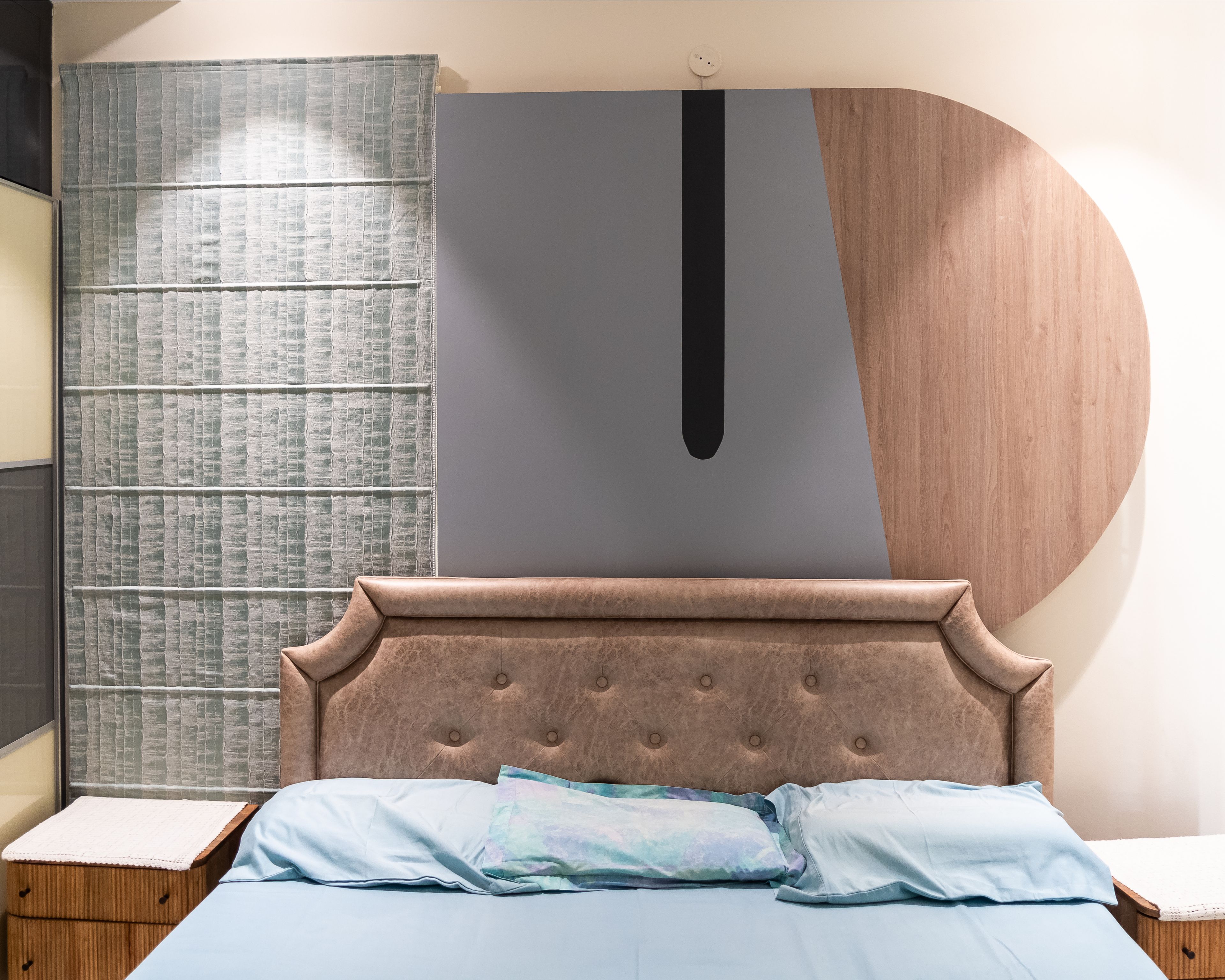 Master Bedroom Design with Blue and Wooden Wall Panel and Tufted Bed Headboard