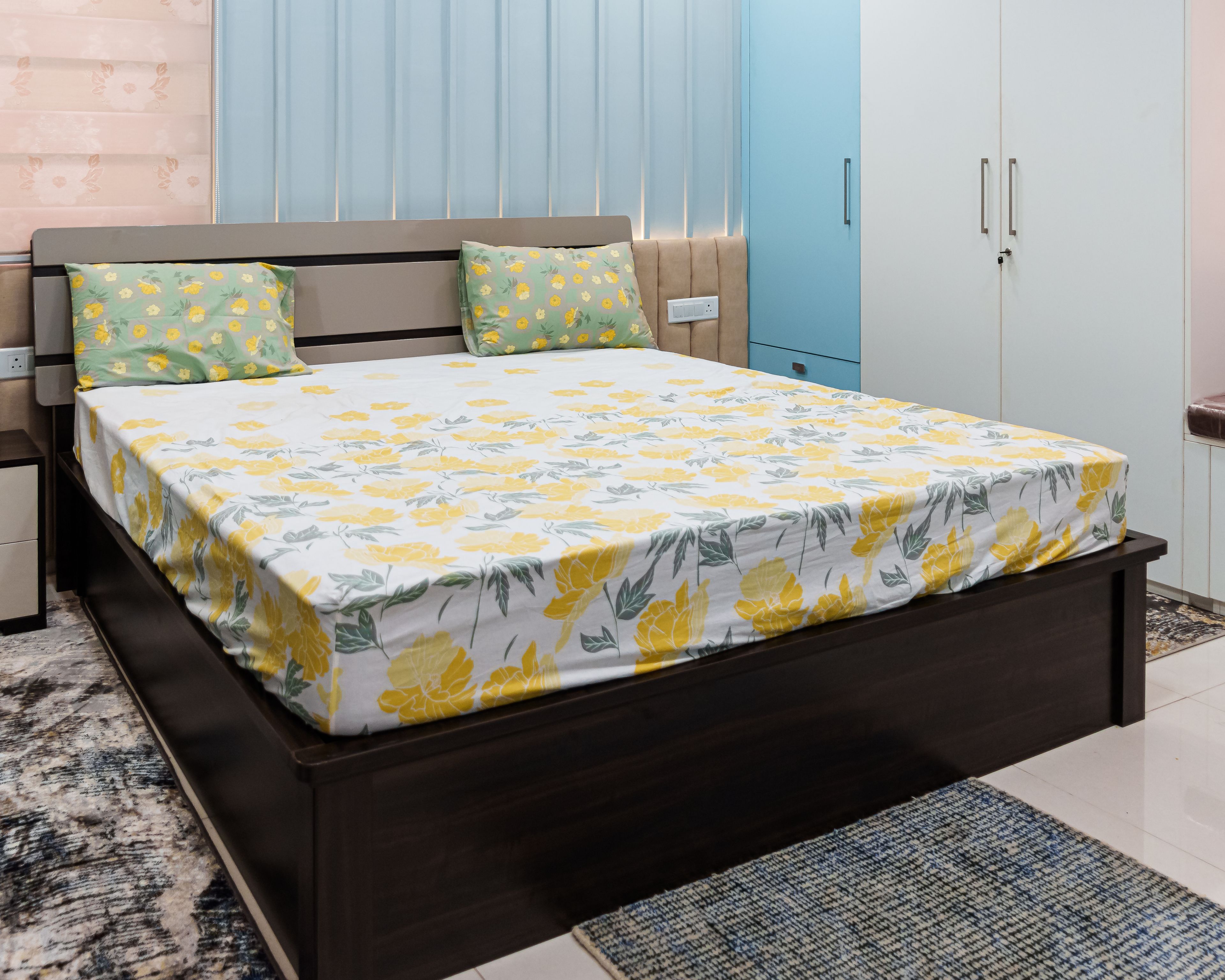 Kids Bedroom Design with Blue Wall Panels and Yellow Floral Bedding