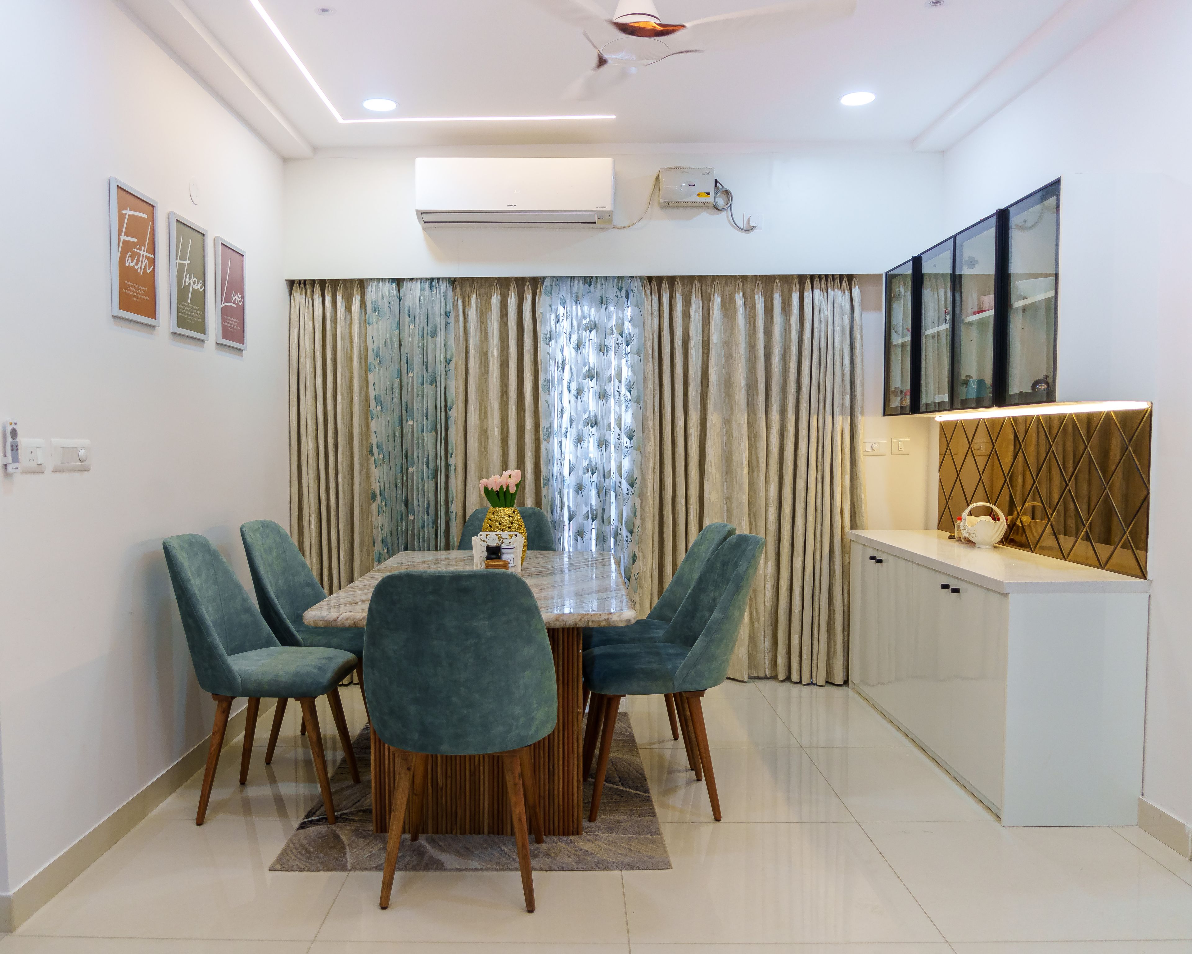 Dining Room Design with Teal Chairs, Diamond Patterned Wall Backsplash, and White Crockery Unit