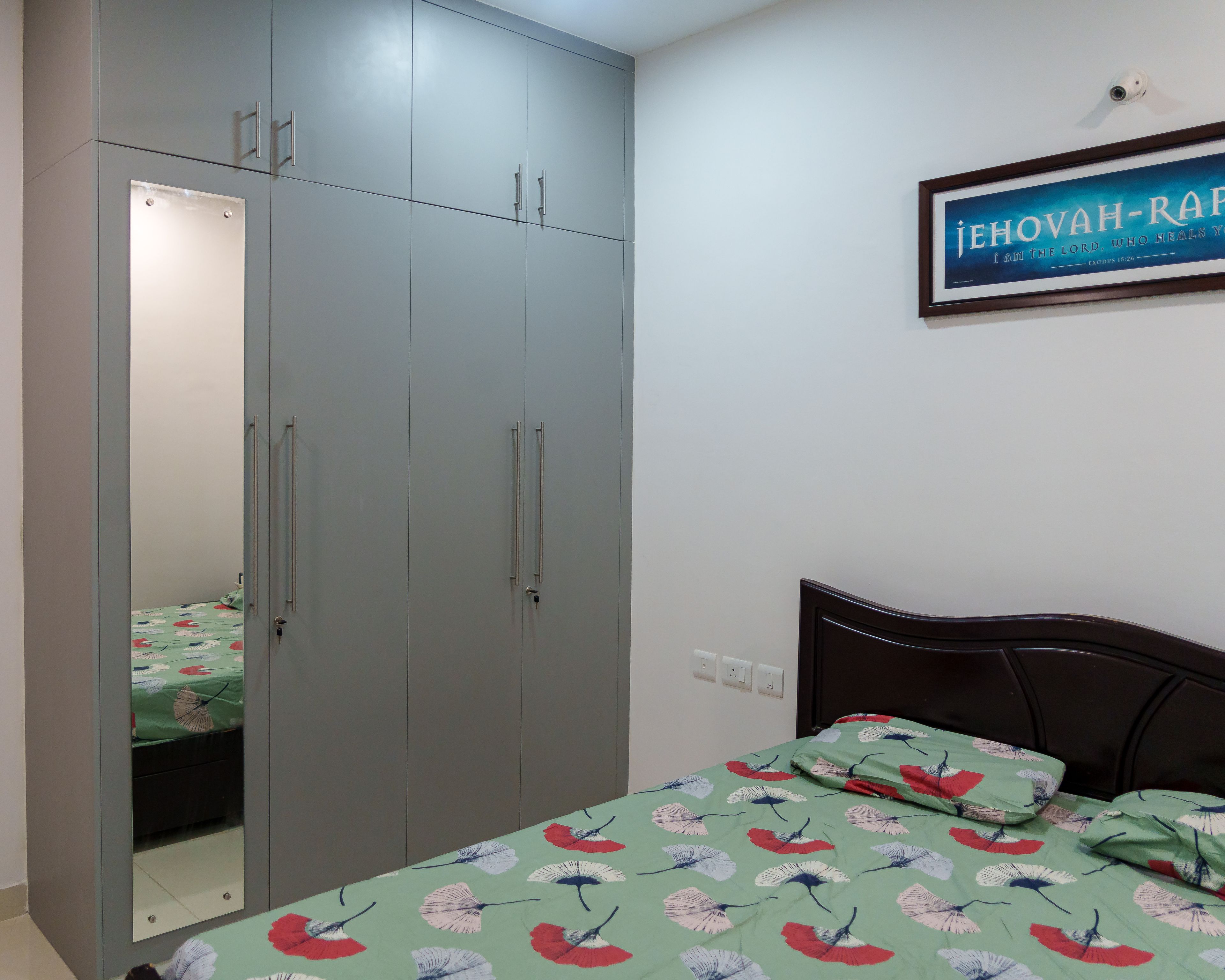 4-Door Wardrobe Design with Grey Swing Doors and Integrated Mirror