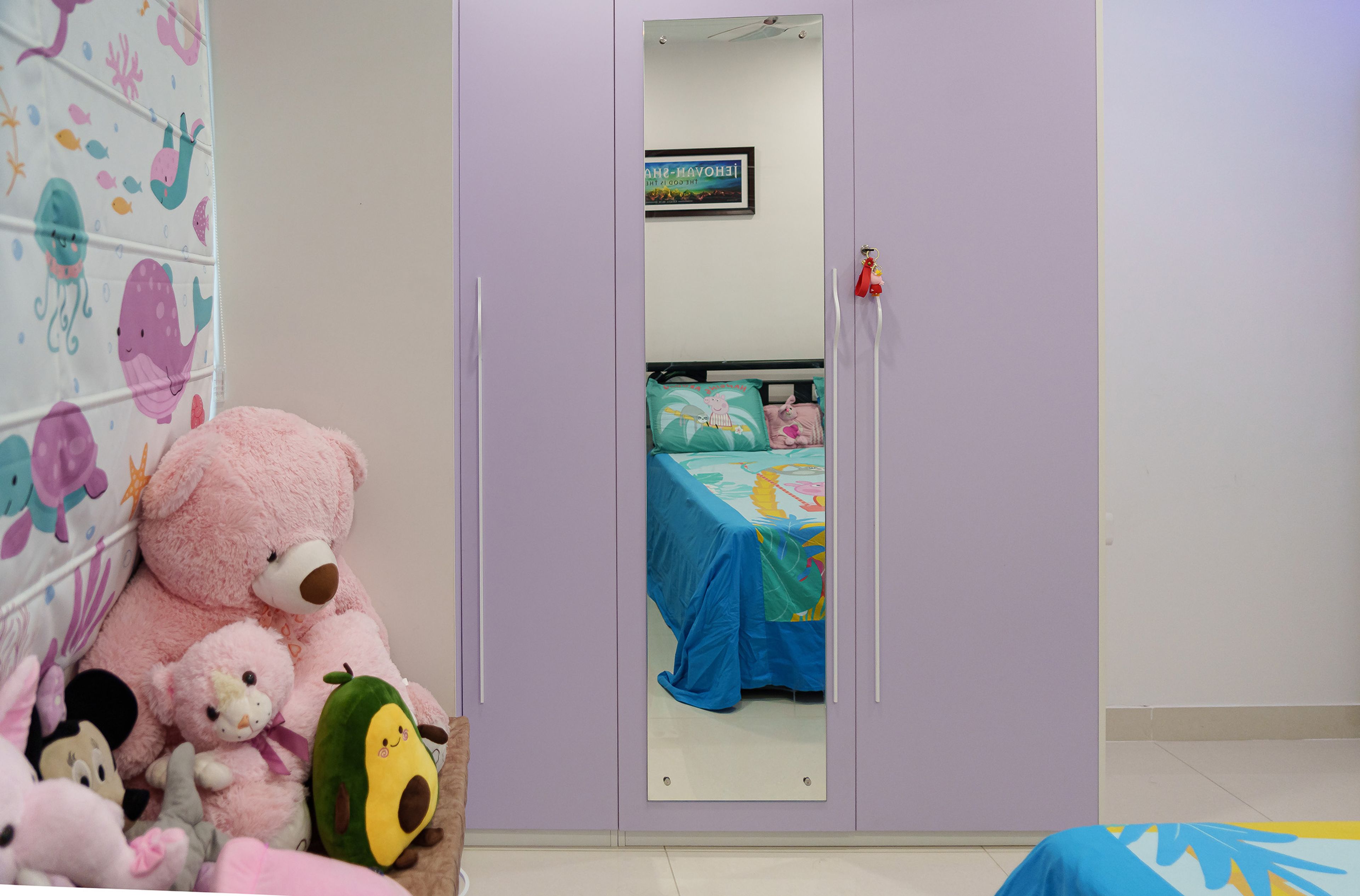 Kids Bedroom Design with Lavender Wardrobe, Mirror Shutter, and Cartoon-Themed Bedding