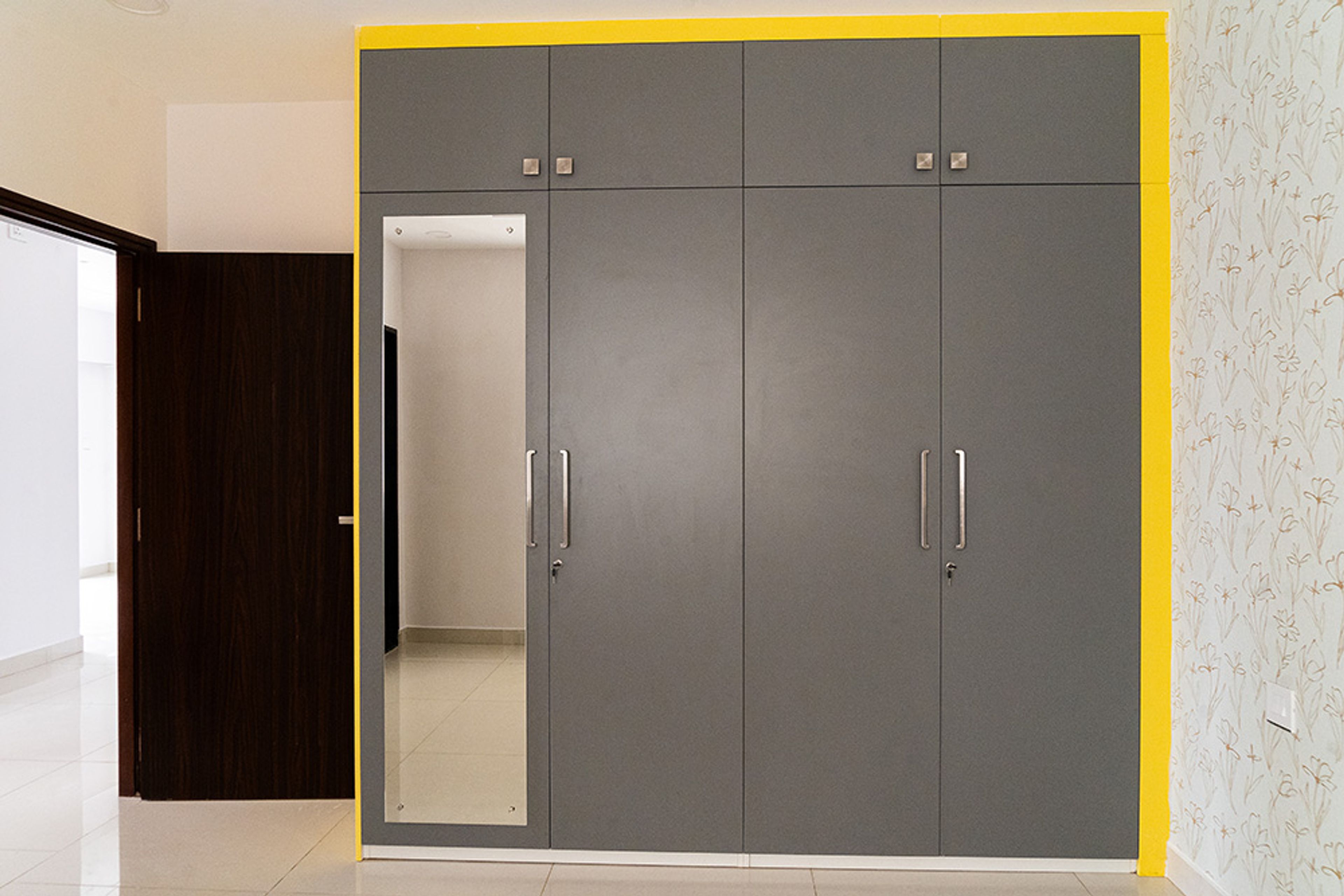 Dark Grey 4-Door Swing Wardrobe Design with Integrated Mirror
