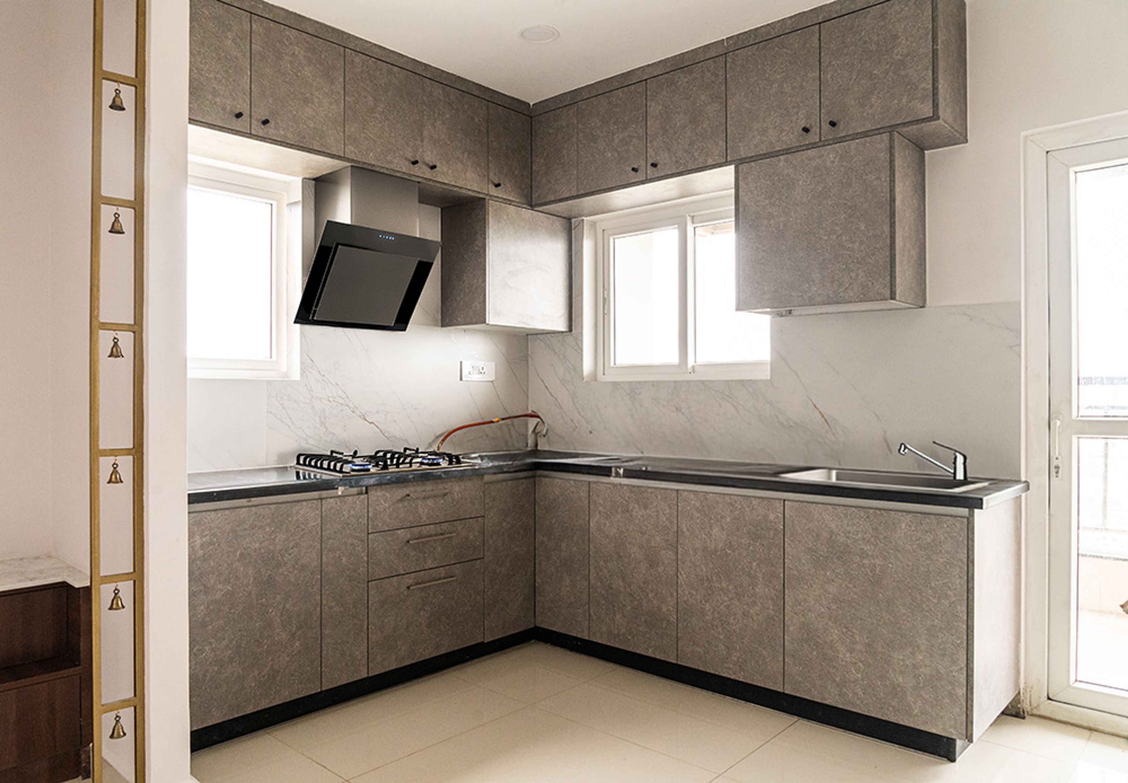 Modern L-Shaped Kitchen Design in Brown With Vertical Storage Units