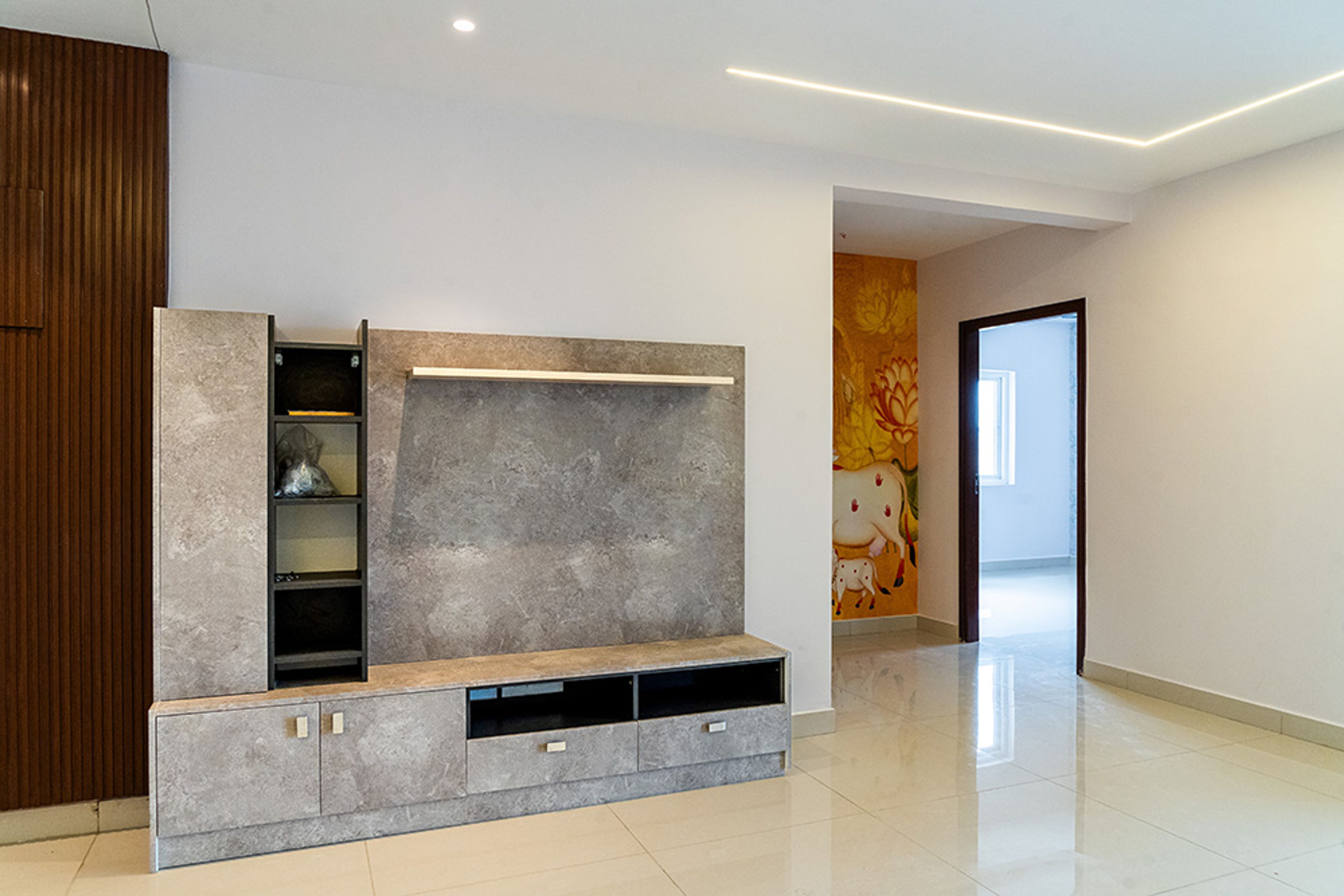 Living Room Design with Grey Marble Patterned TV Unit Design and Orange Cow Themed Ethnic Wallpaper