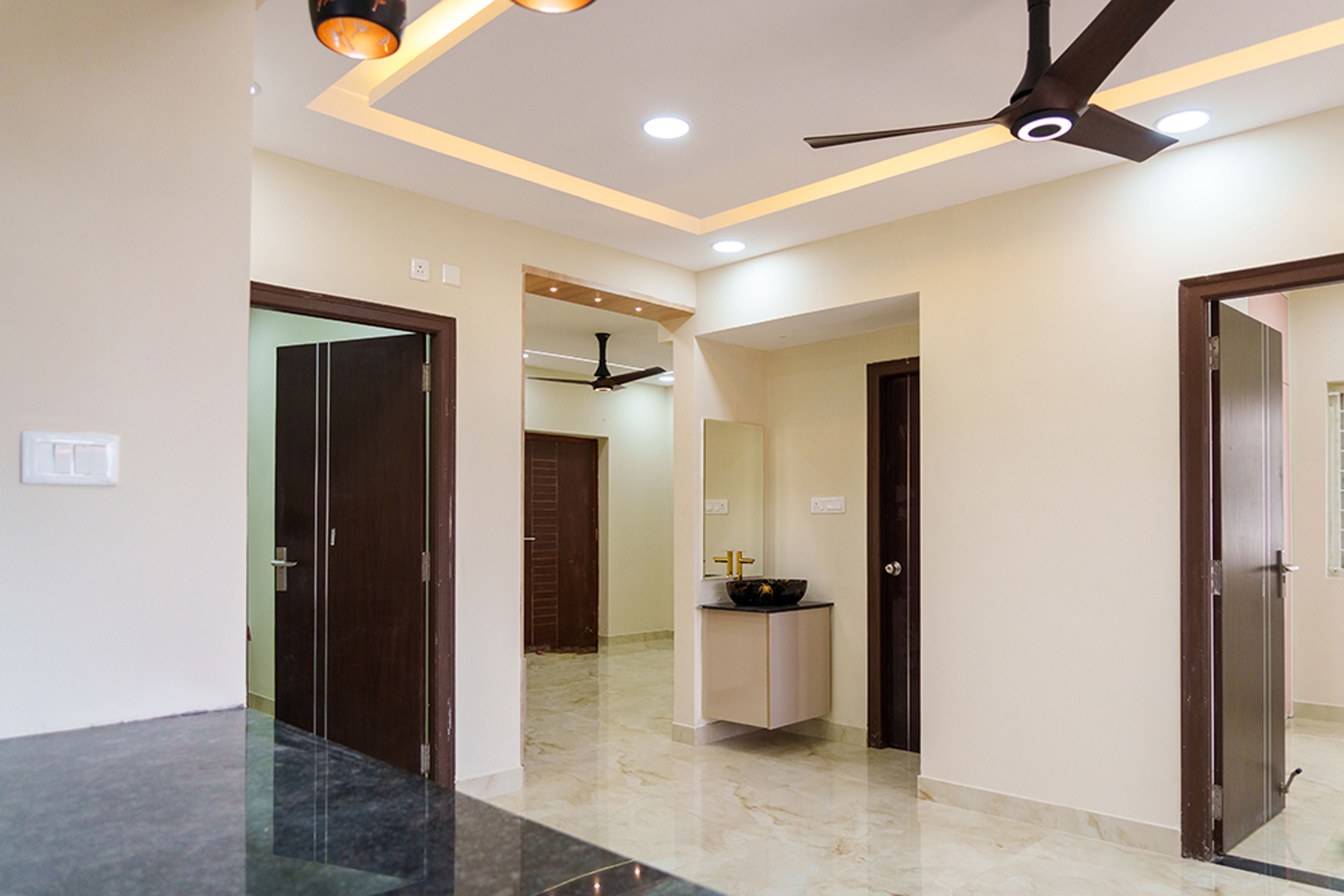 Living Room with Peripheral False Ceiling Design