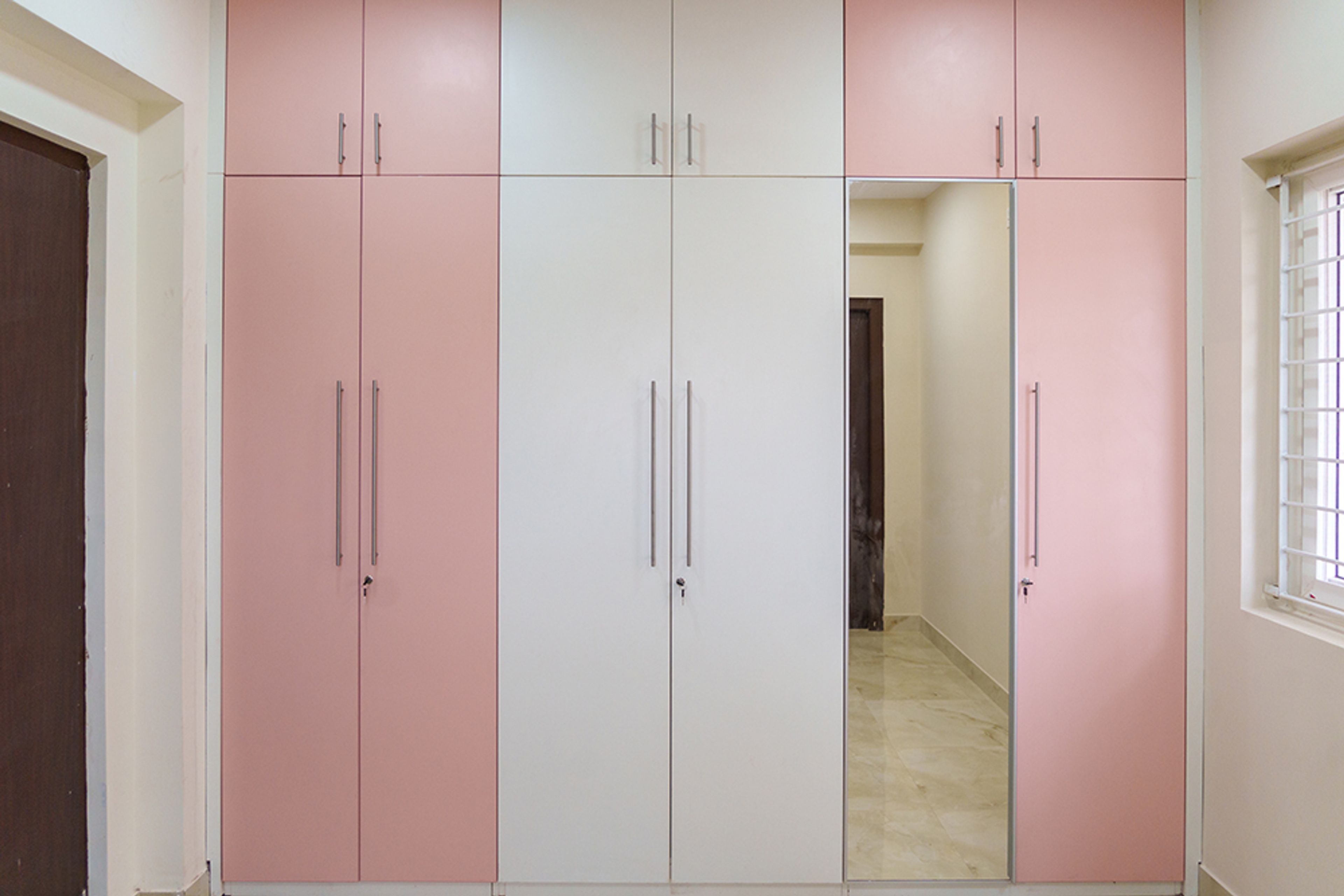 6-Door Off-White Swing and Pink Wardrobe Design with integrated mirror