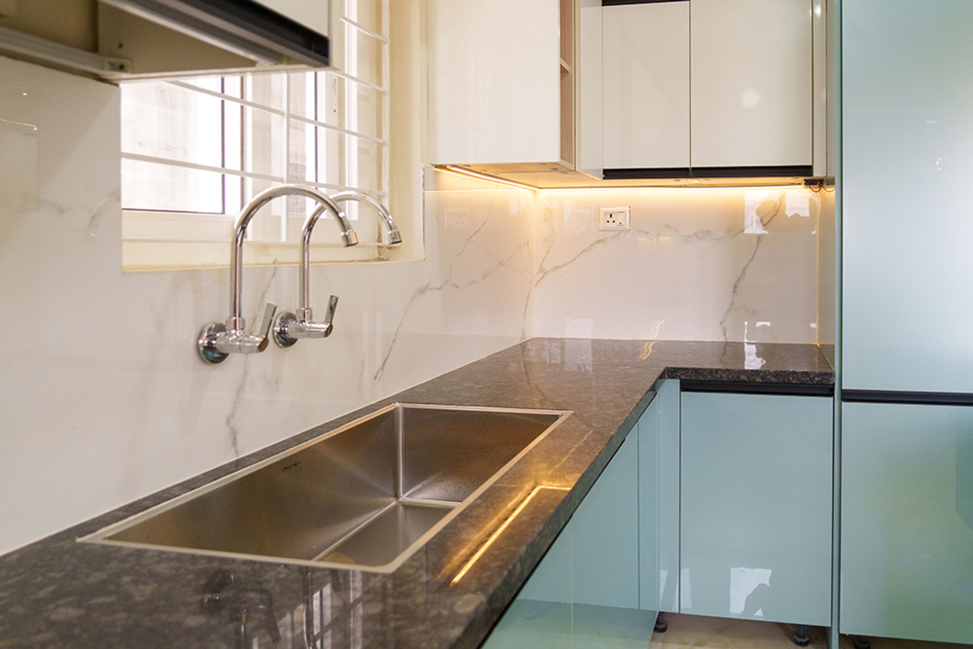 U-Shaped Kitchen Design with Aqua Blue Base Cabinets and Under Cabinet Lighting