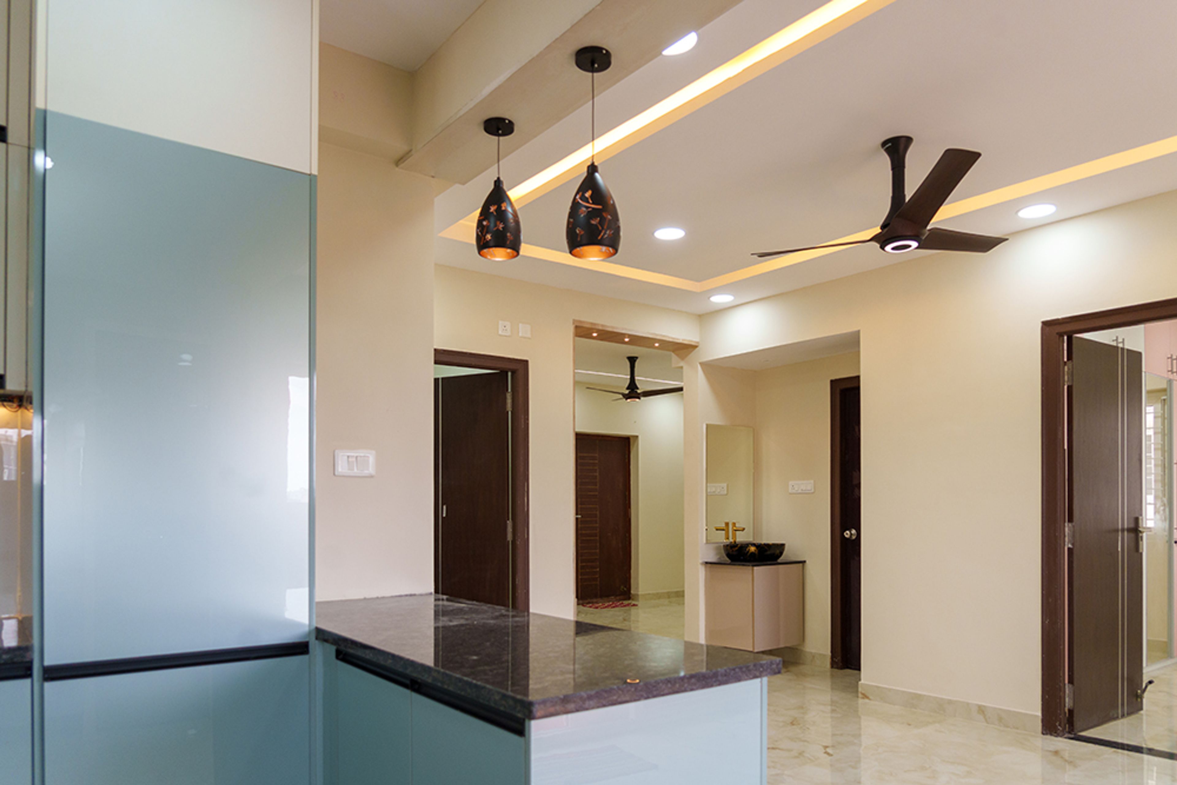 U-Shaped Kitchen Design with Aqua Blue Cabinets and Black Granite Countertop