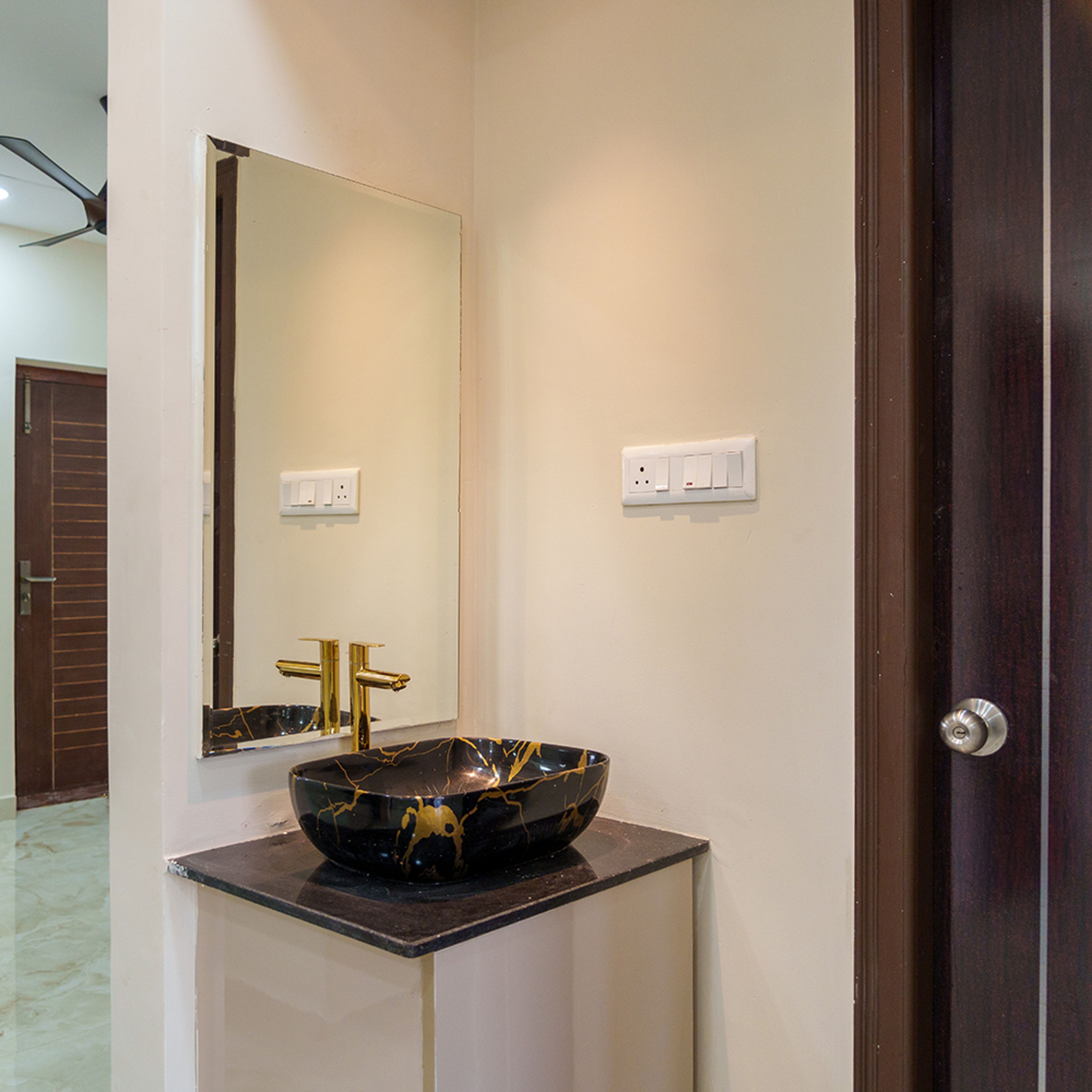 Vanity with mirror and black sink