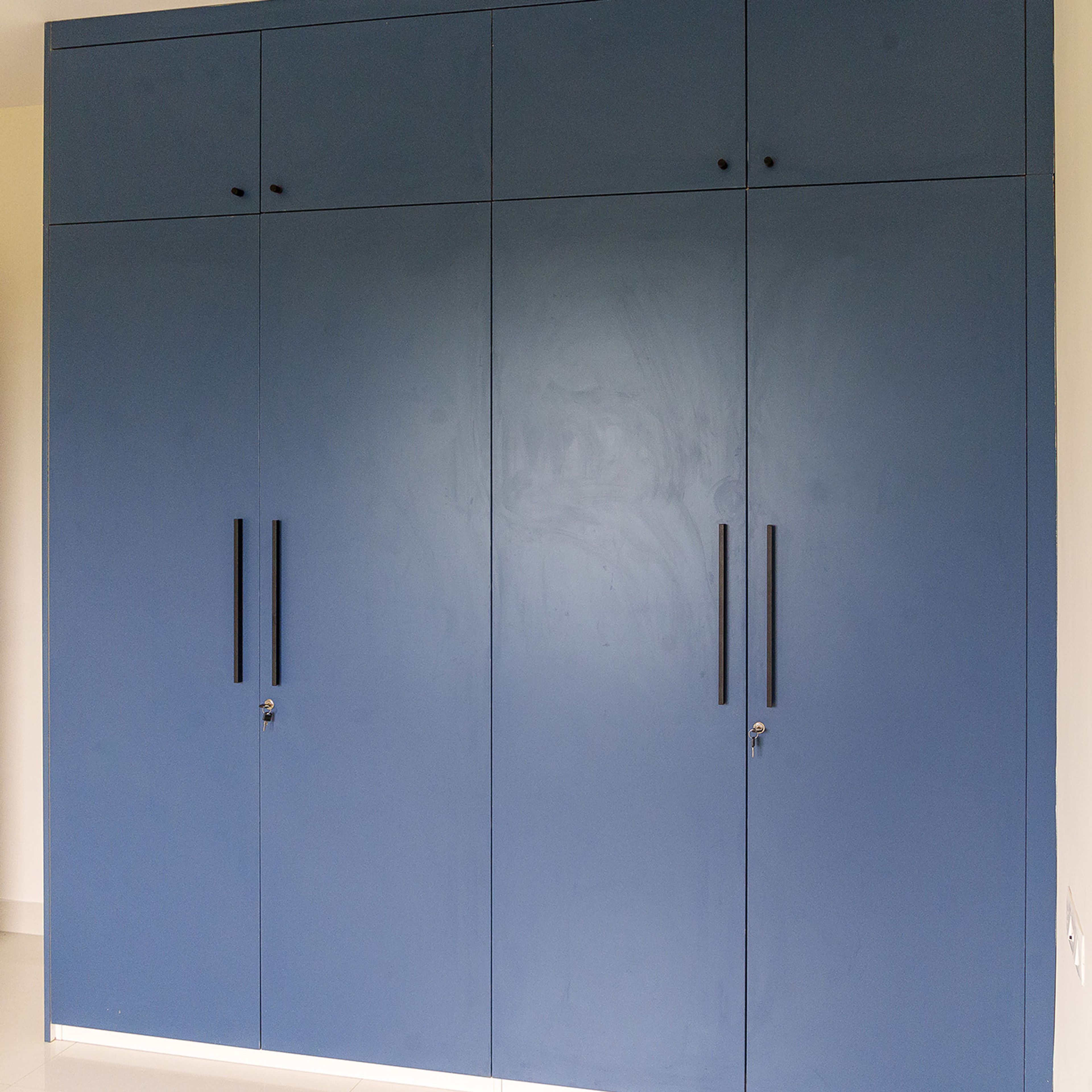 4-Door Matte Blue Swing Wardrobe Design with Loft Unit