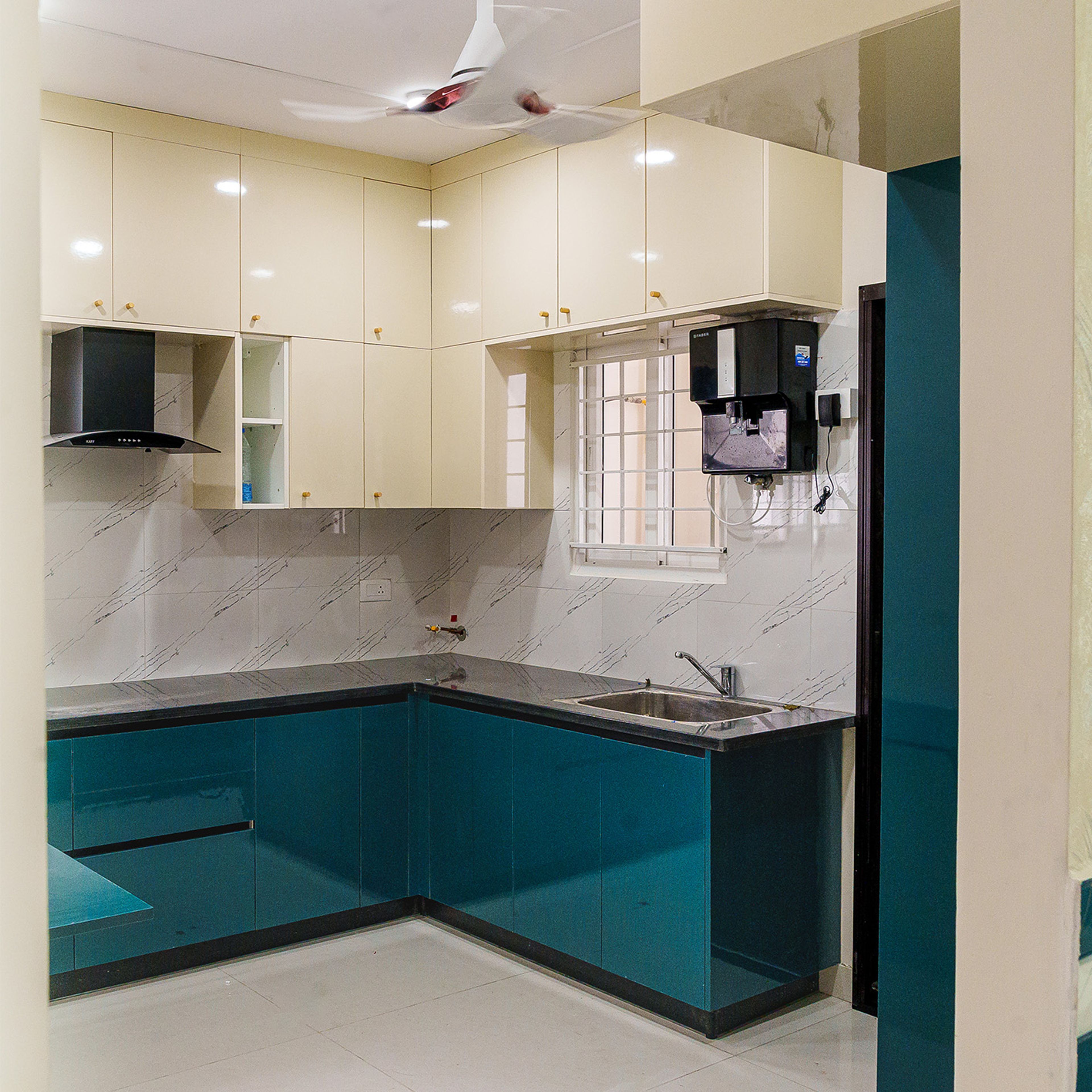 L-Shaped Kitchen Design with Teal and Off-White Units