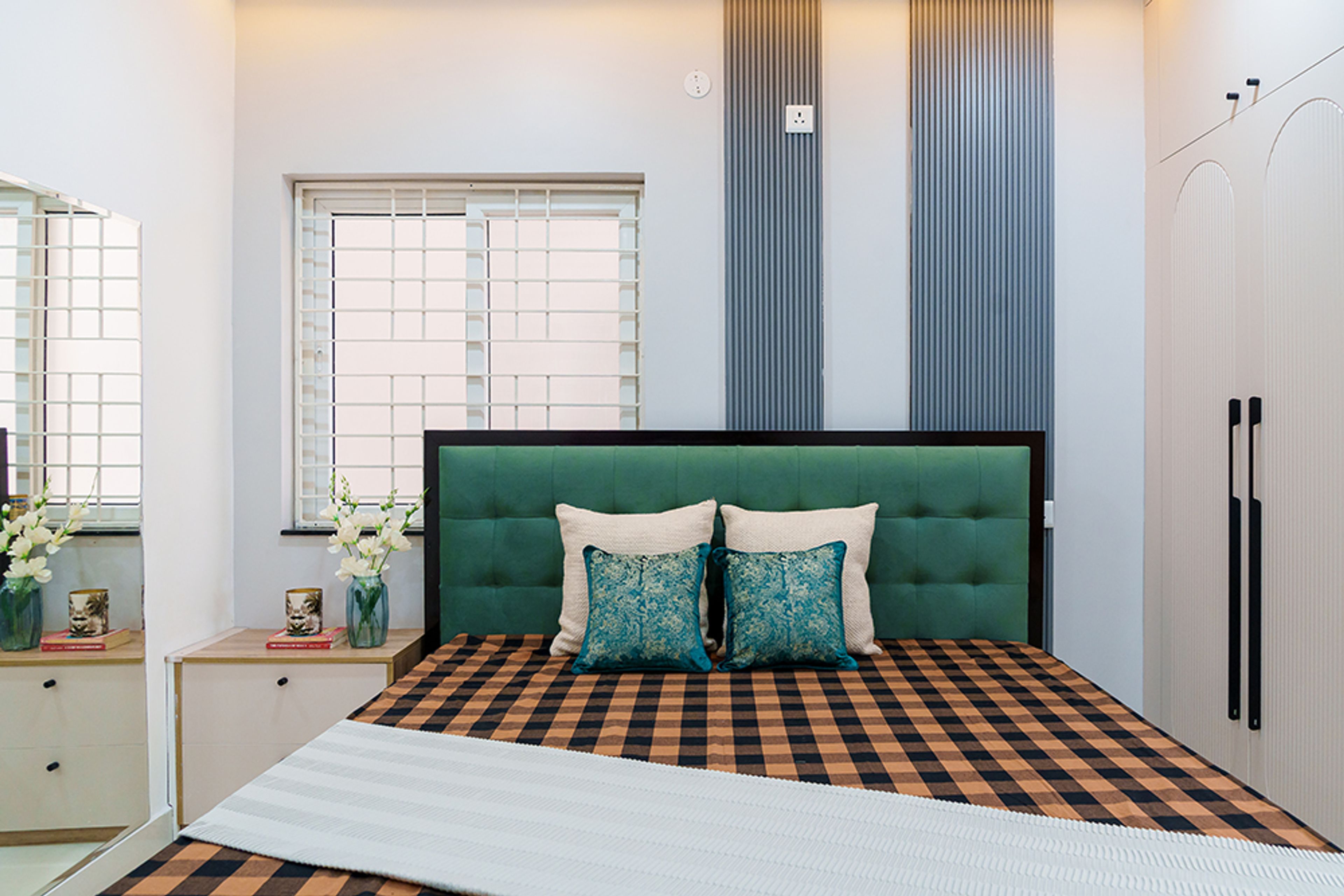 Bedroom Design with grey wall slats and green headboard bed