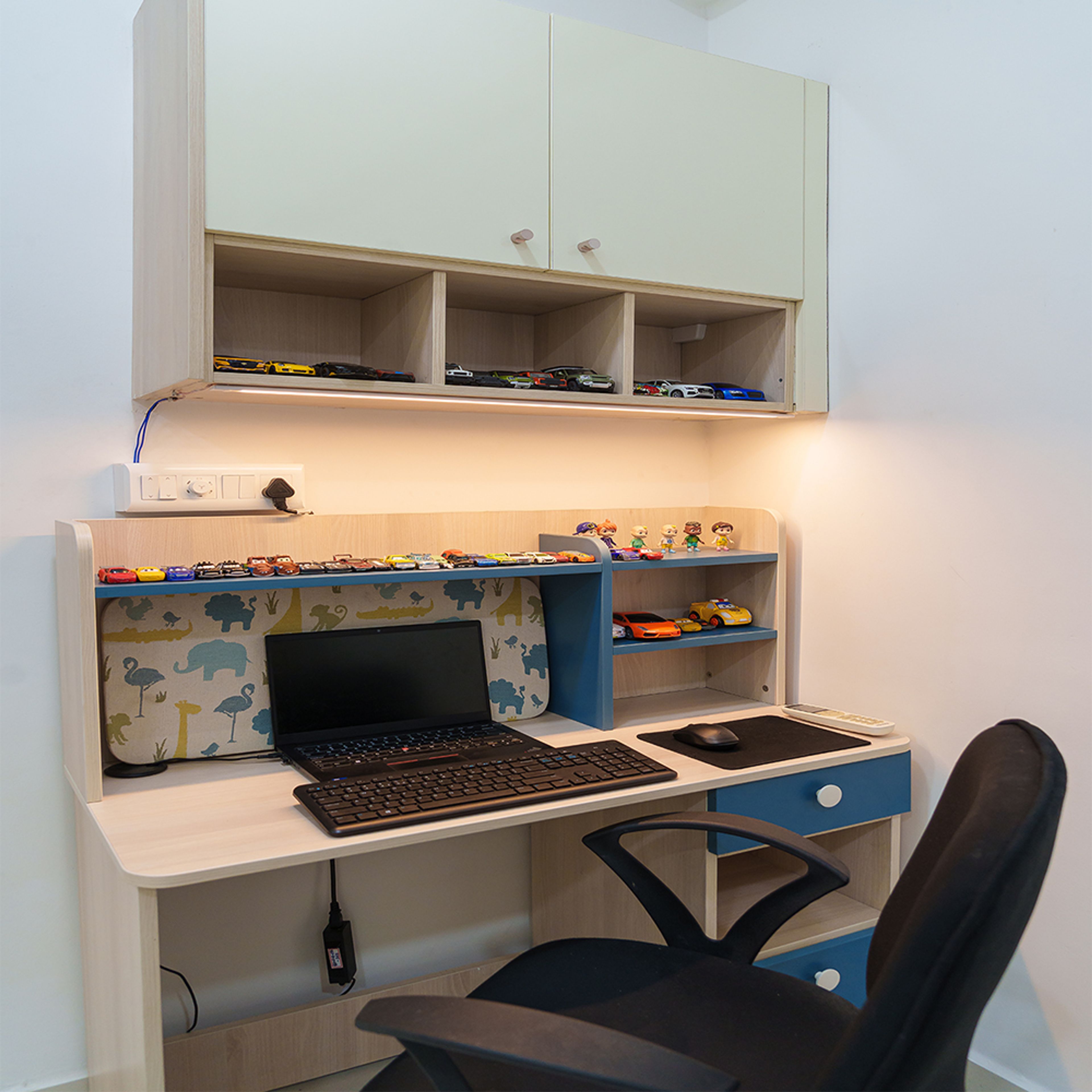 Cream and blue study space design with wall mounted shelves