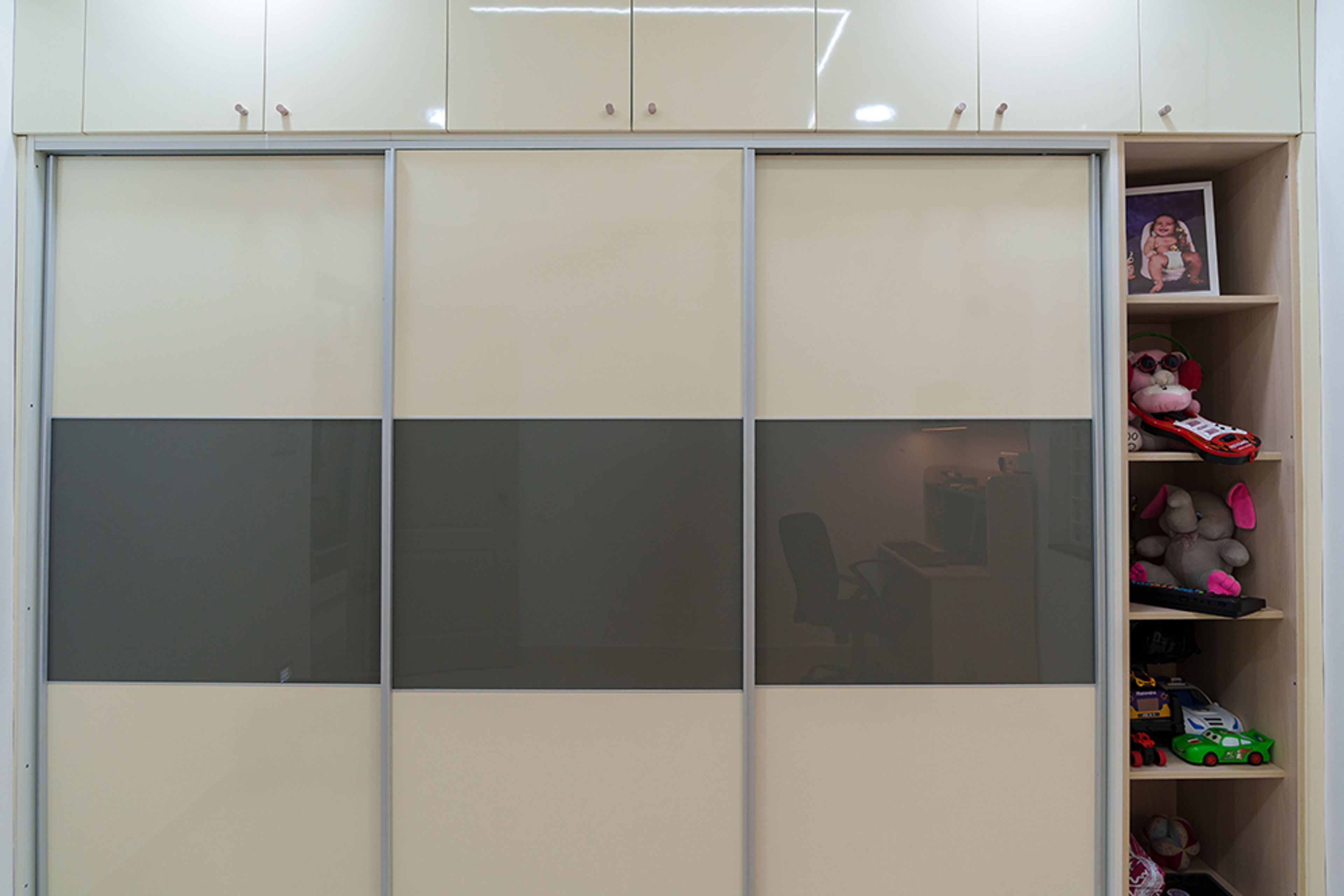 Beige and black 3-door sliding wardrobe design