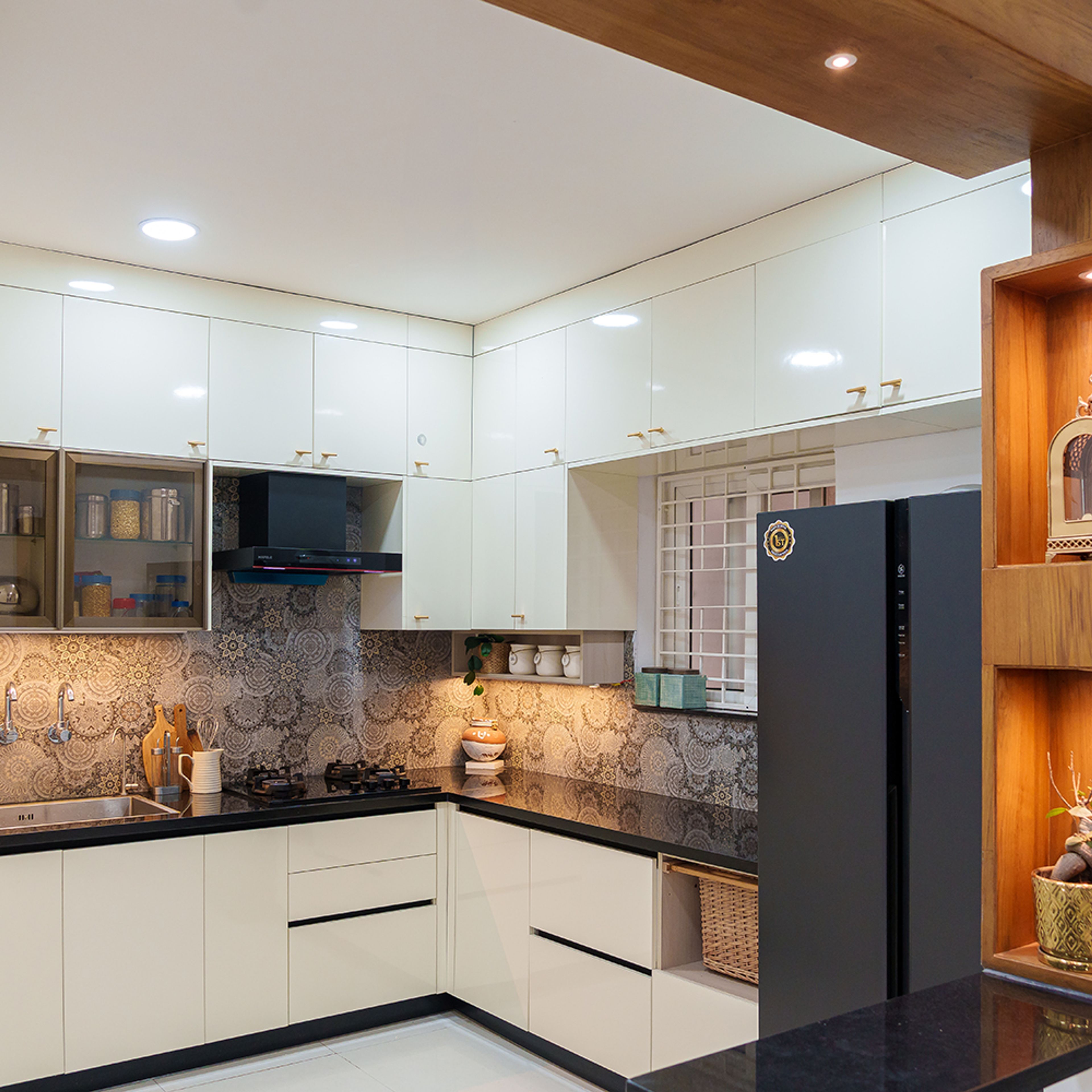 L-shaped kitchen design with cream units
