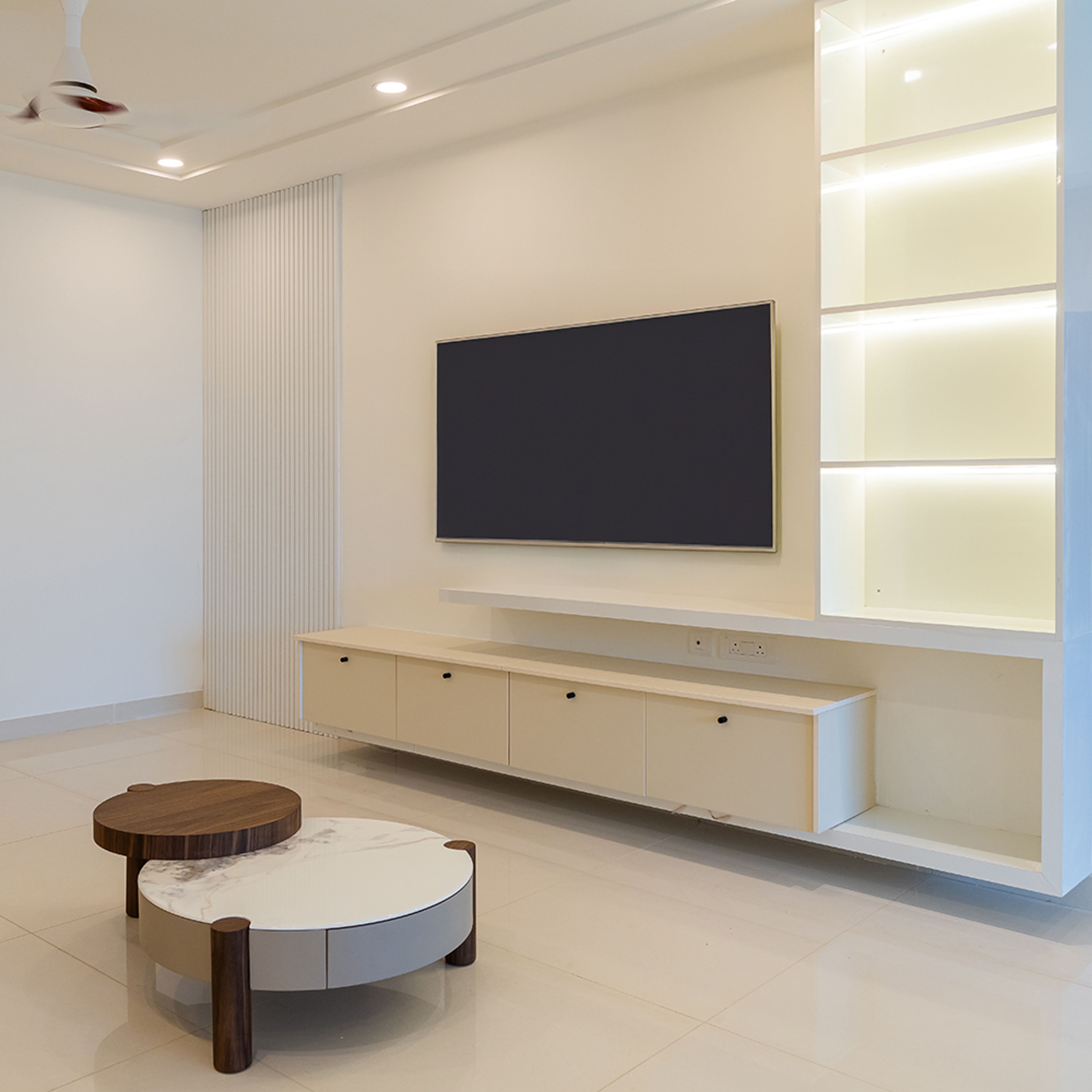 TV Unit Design with Cream Cabinets and White Illuminated Wall Cabinets