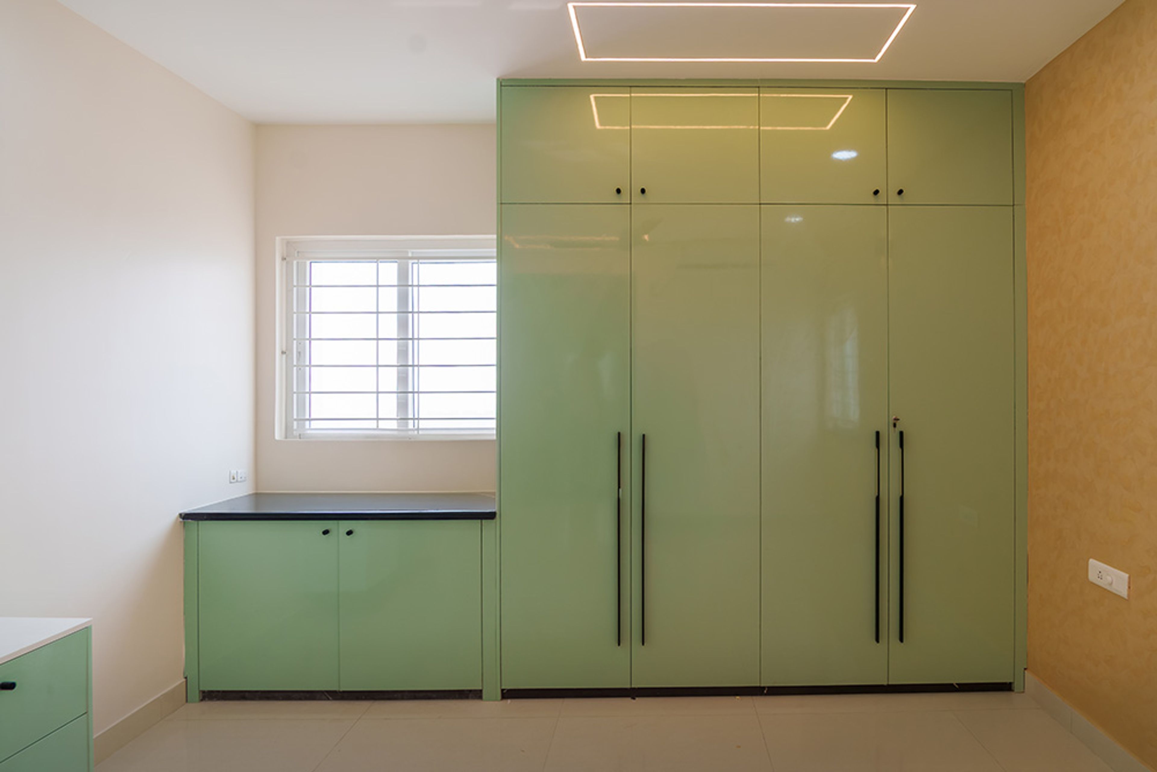 4-Door Green Swing Wardrobe Design with Attached Study Unit