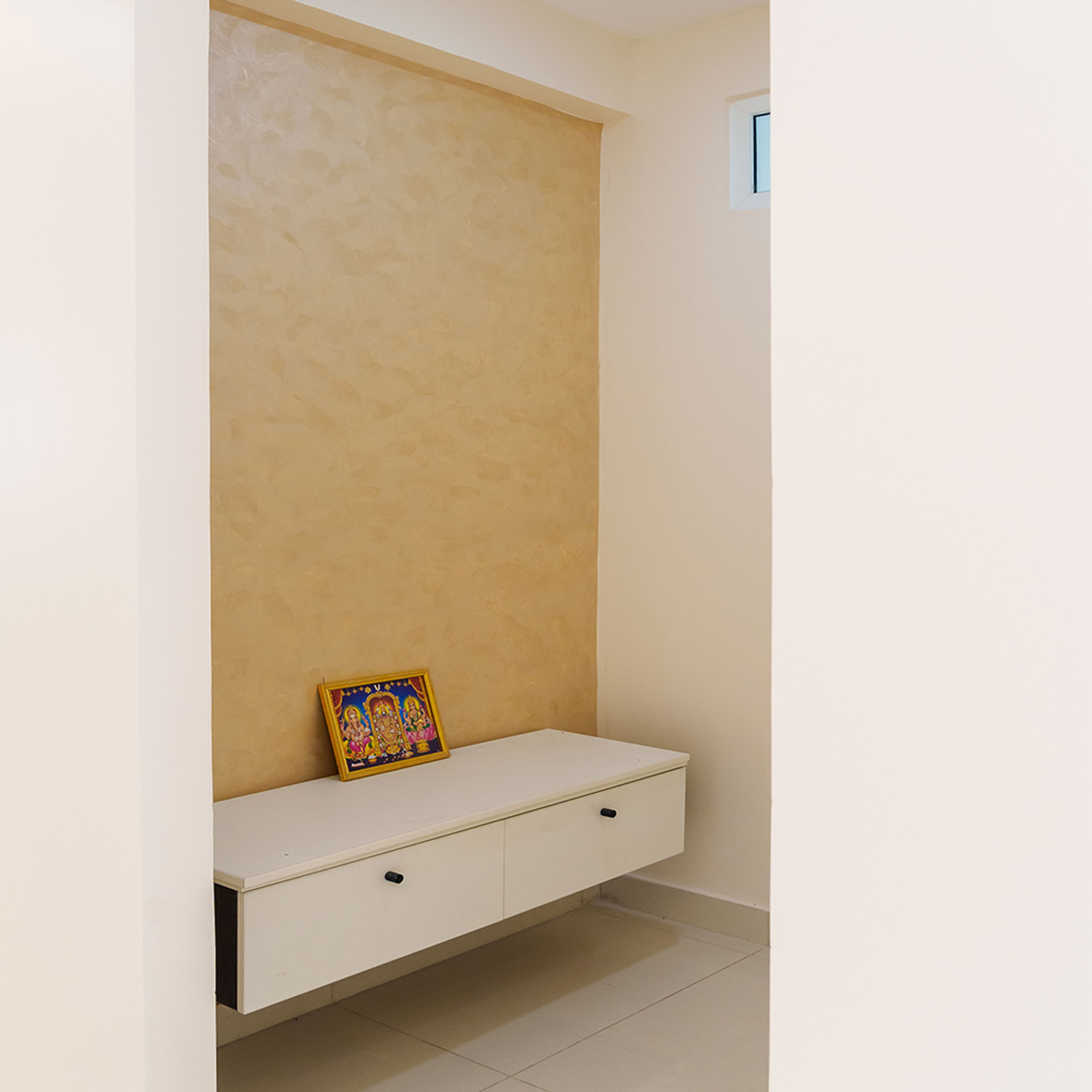 Pooja Unit with Floating Off-White Drawers and Textured Yellow Wall