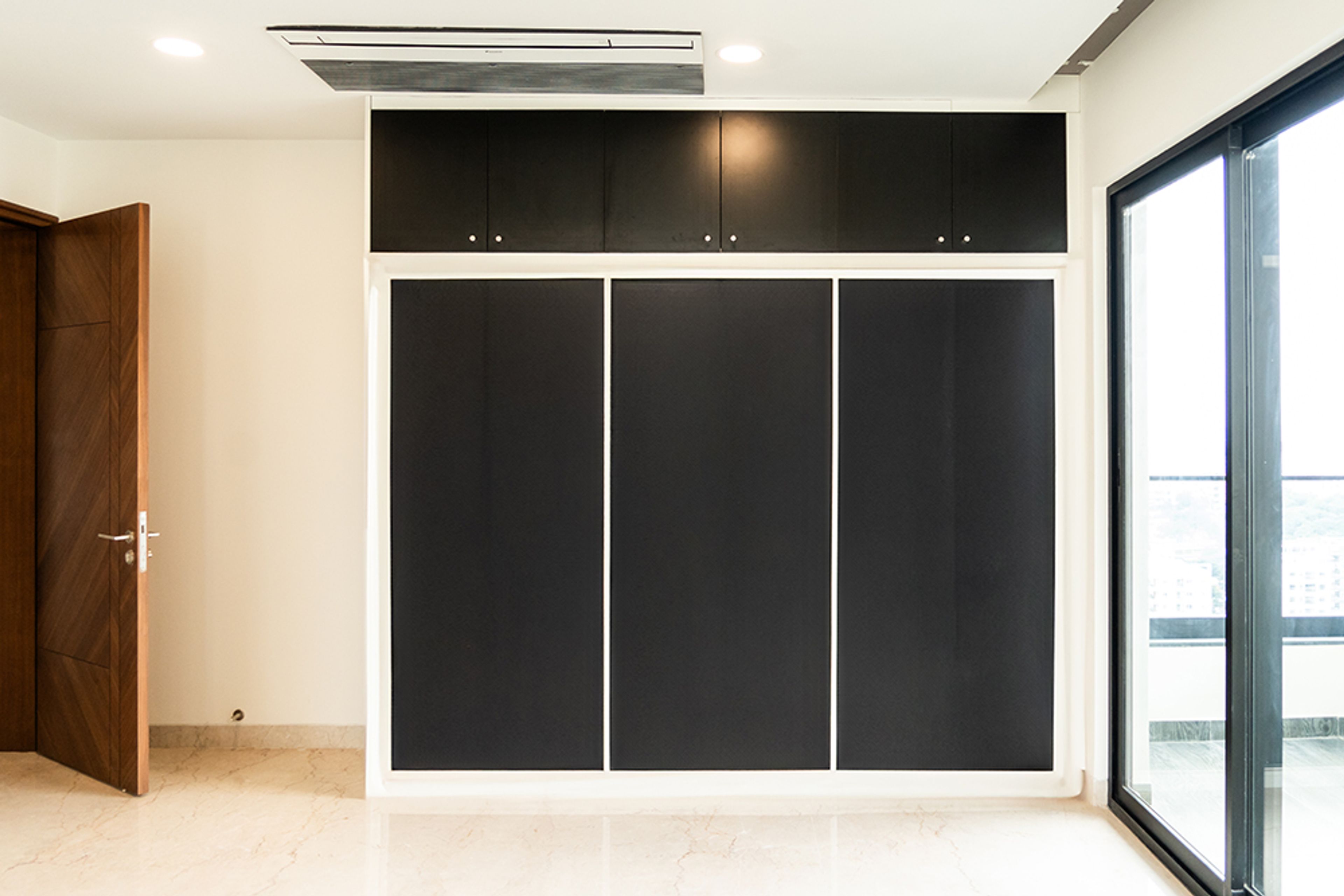 3-Door Black Sliding Wardrobe Design
