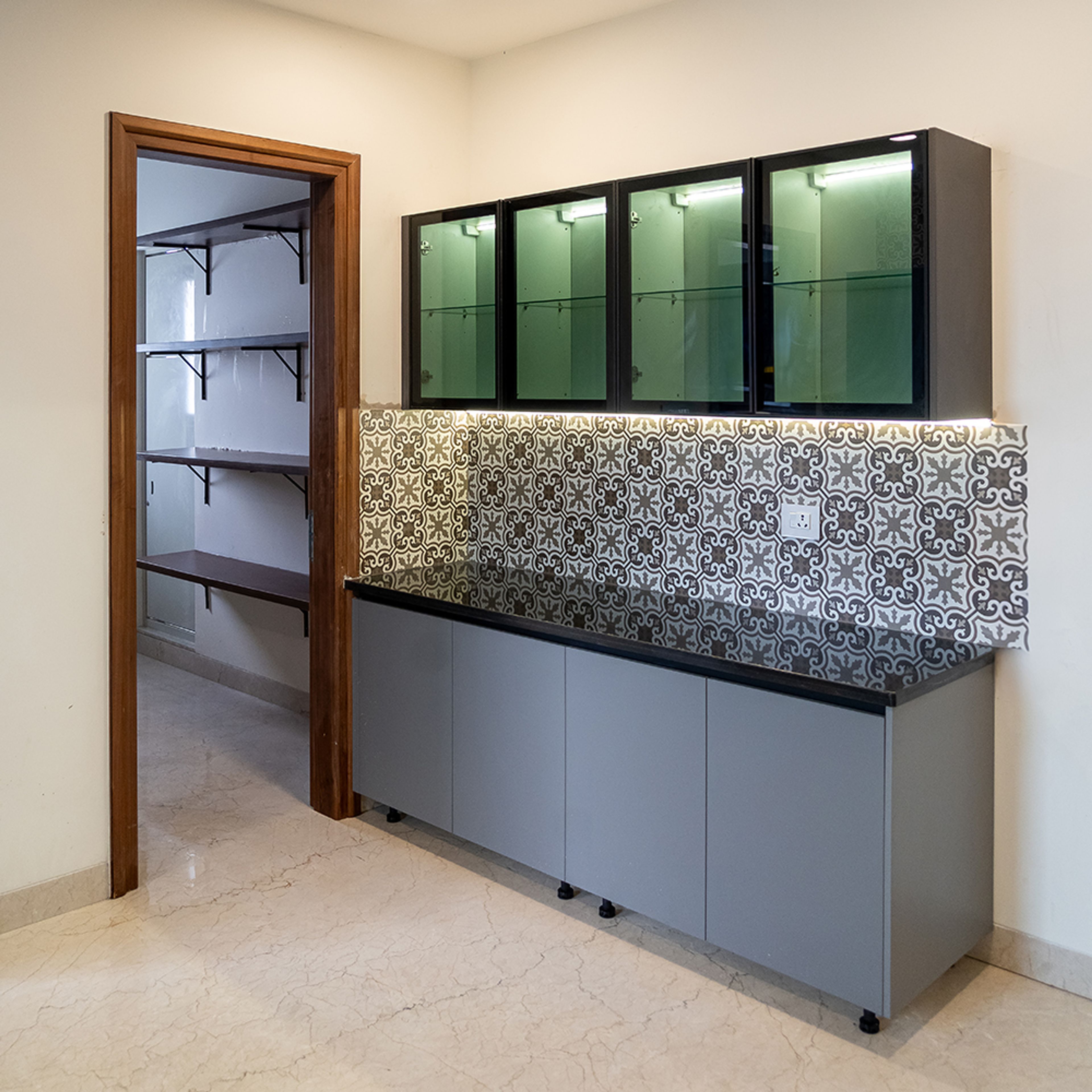 Crockery Unit Design with Grey Cabinets, Glass Shutter Wall Units and Moroccan Backsplash