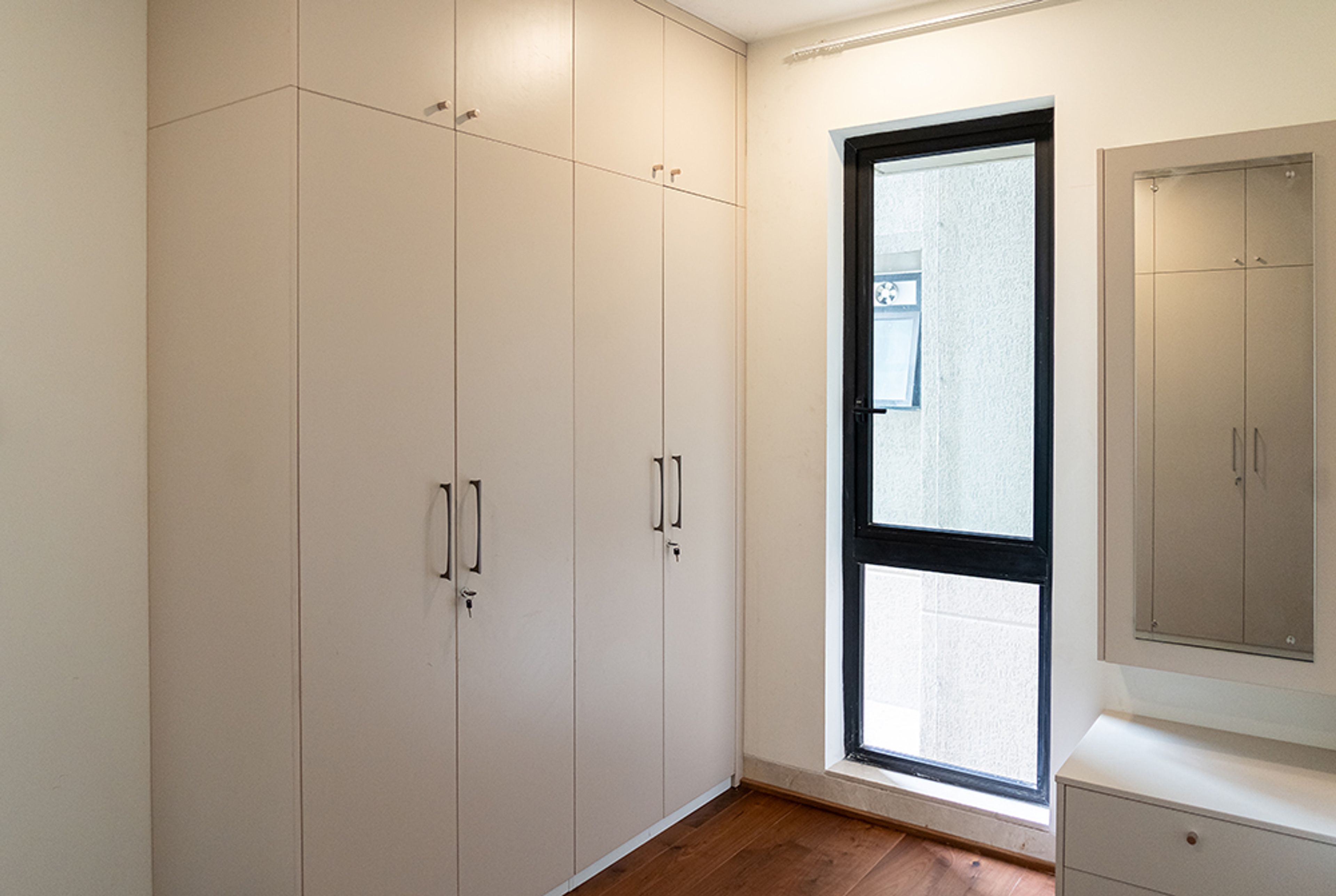 4-Door Beige Swing Wardrobe Design with Loft Unit