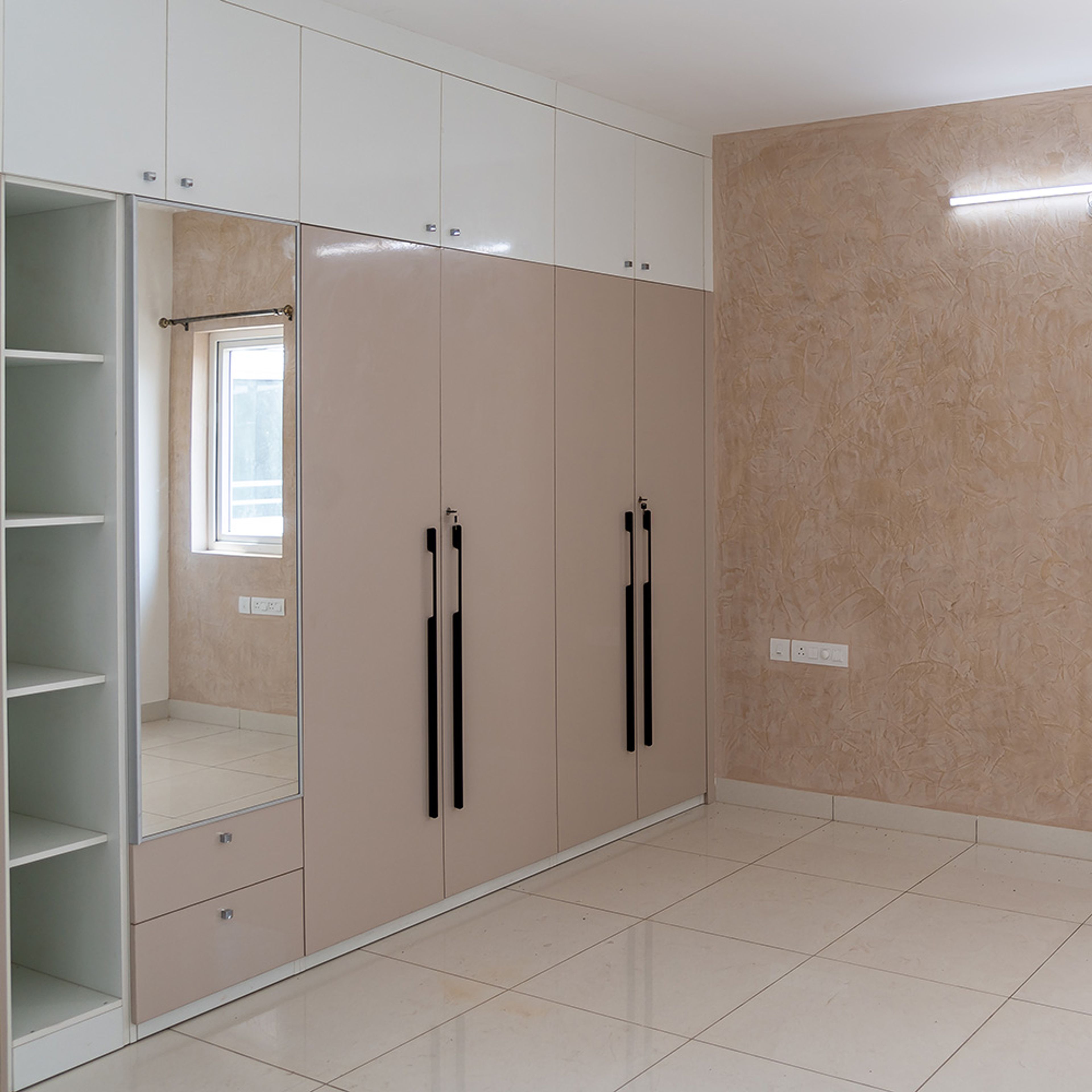 4-door beige swing wardrobe design with integrated mirror