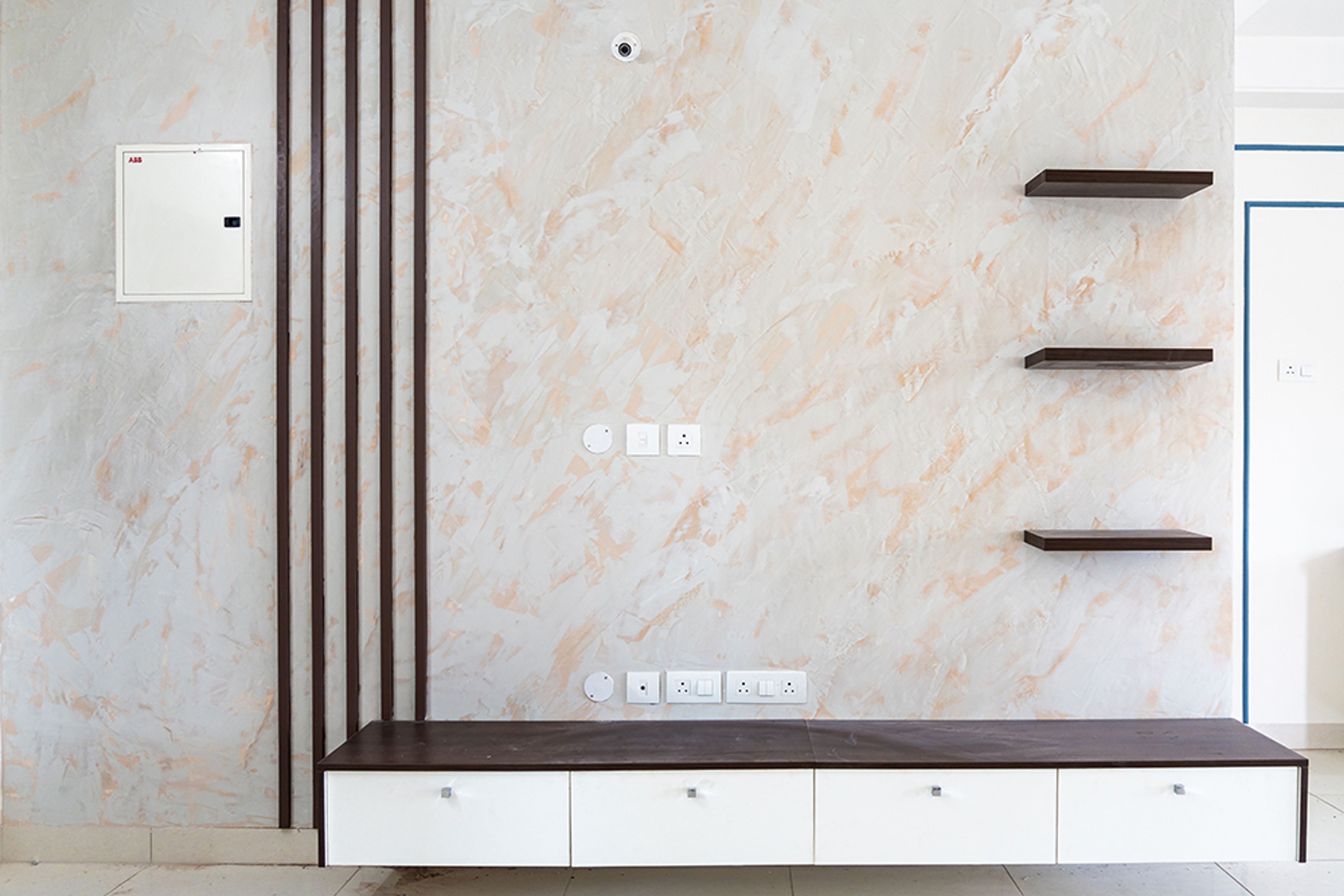 TV unit design with marble patterned backsplash