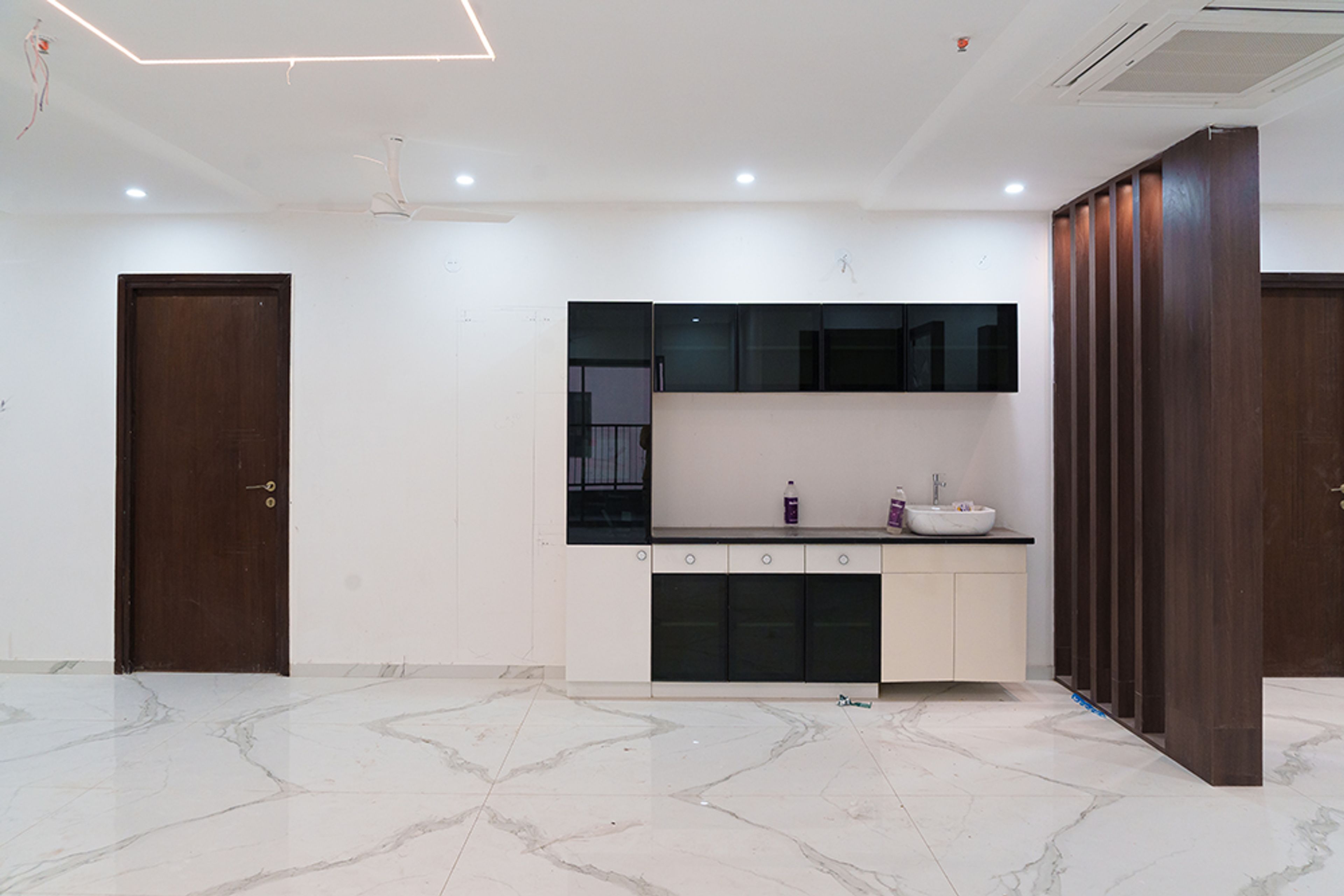 Crockery unit design with black and off-white cabinets