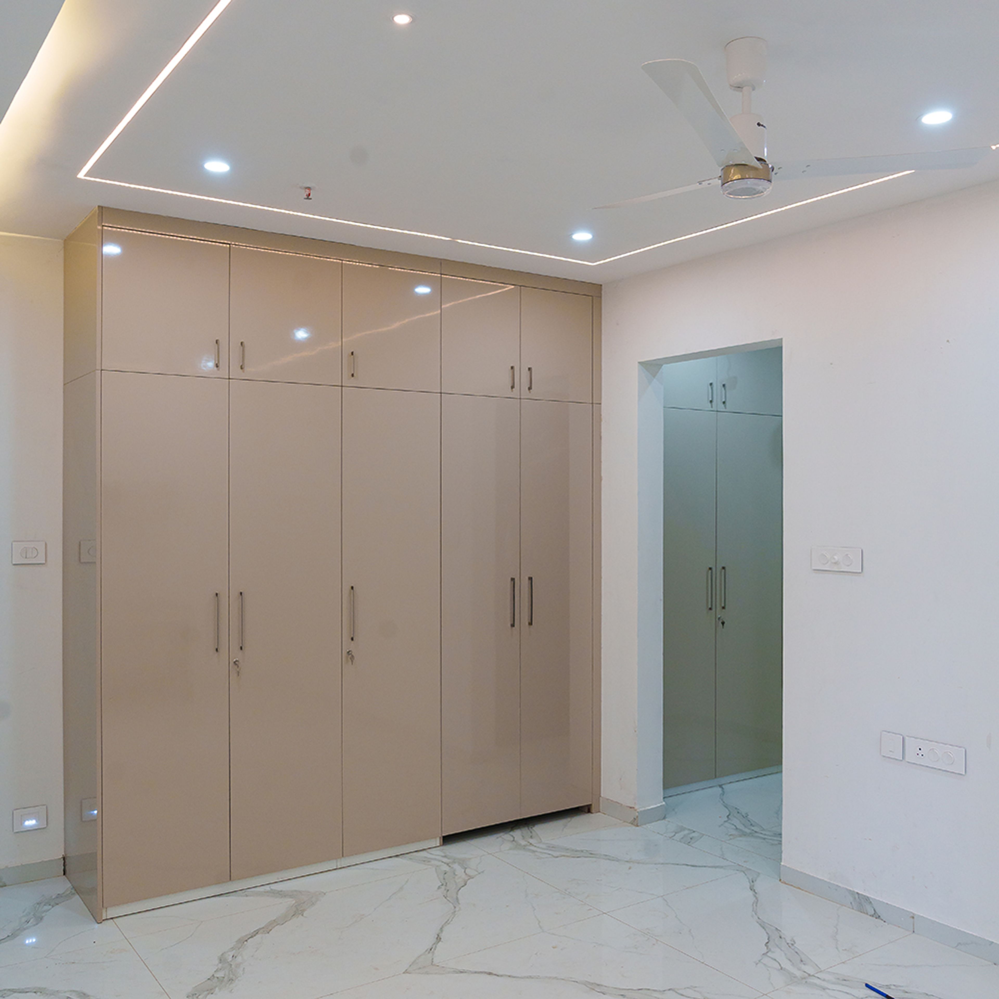 5-door beige glossy swing wardrobe design
