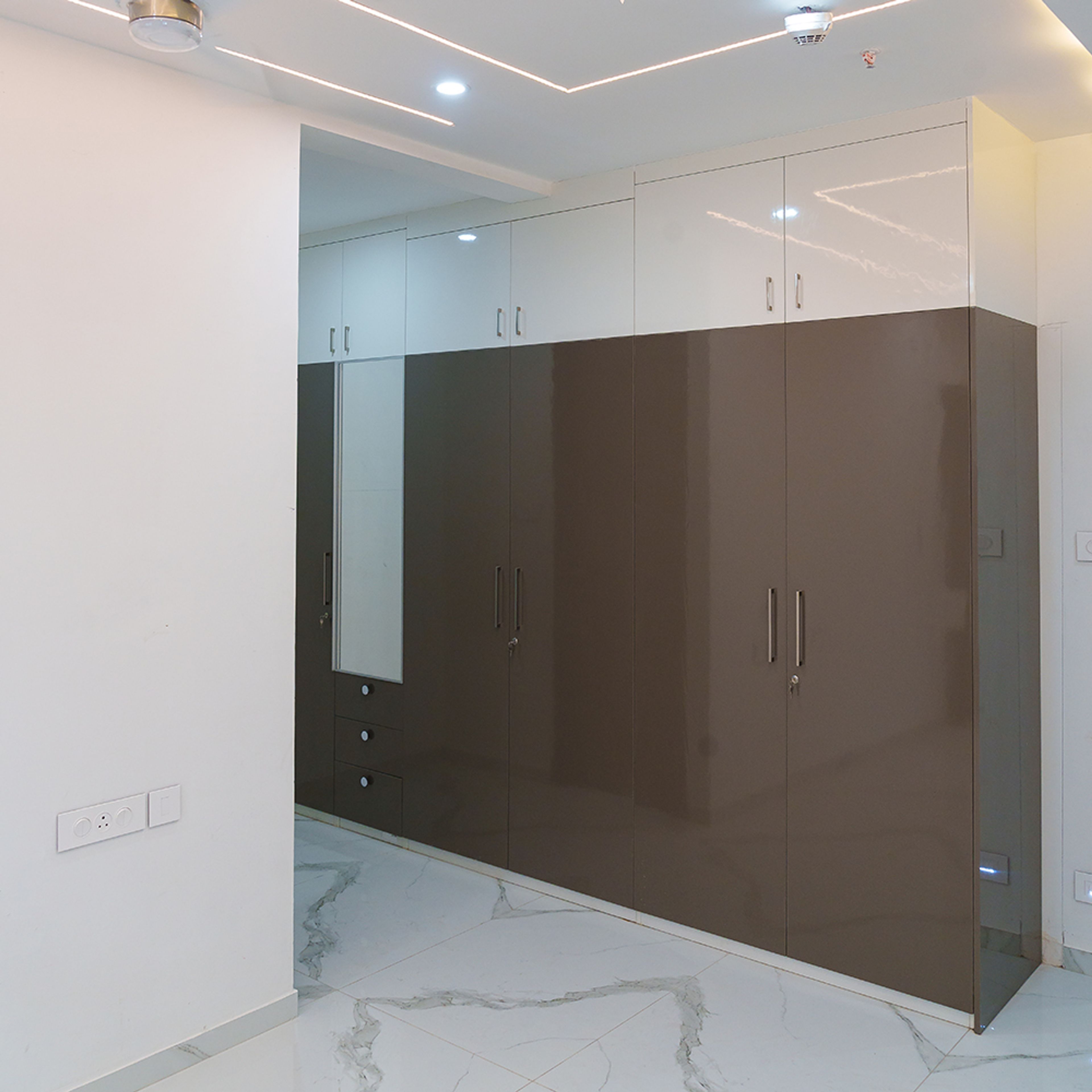 6-door brown swing wardrobe with integrated mirror
