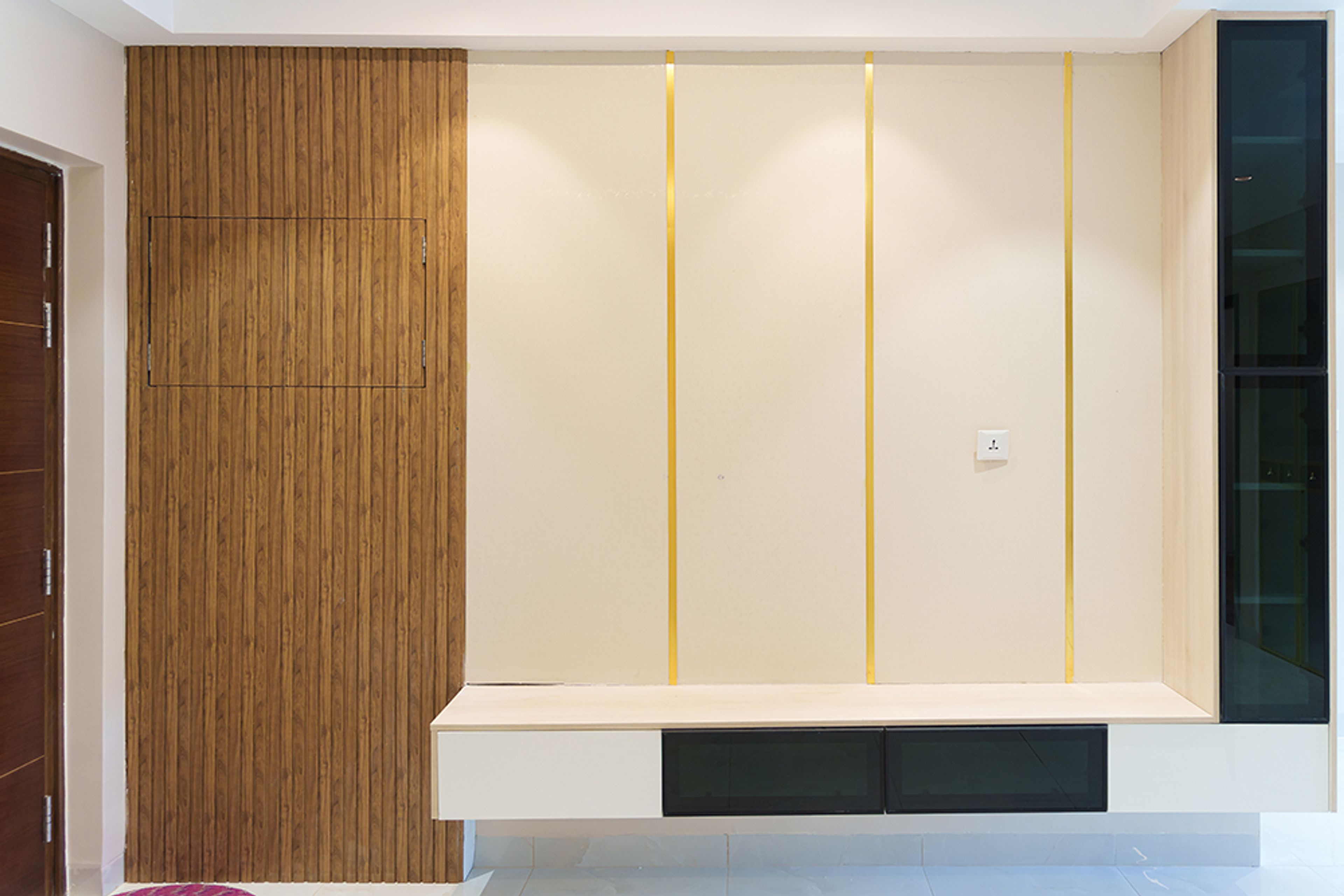 TV Unit Design with Wall-Mounted White Base and Vertical Wooden Panel on Left Side