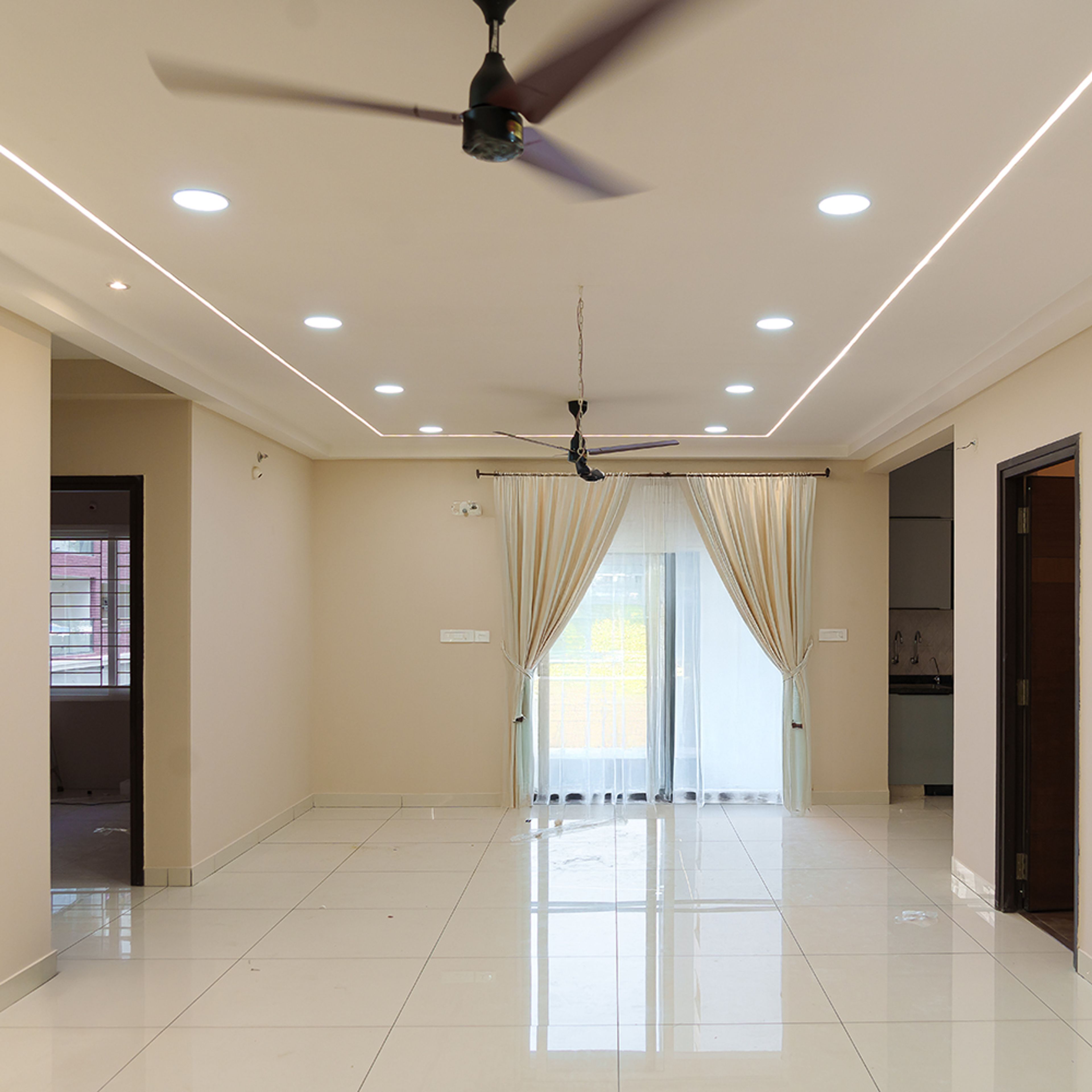Living Room Design with Single Layer False Ceiling with Spotlights