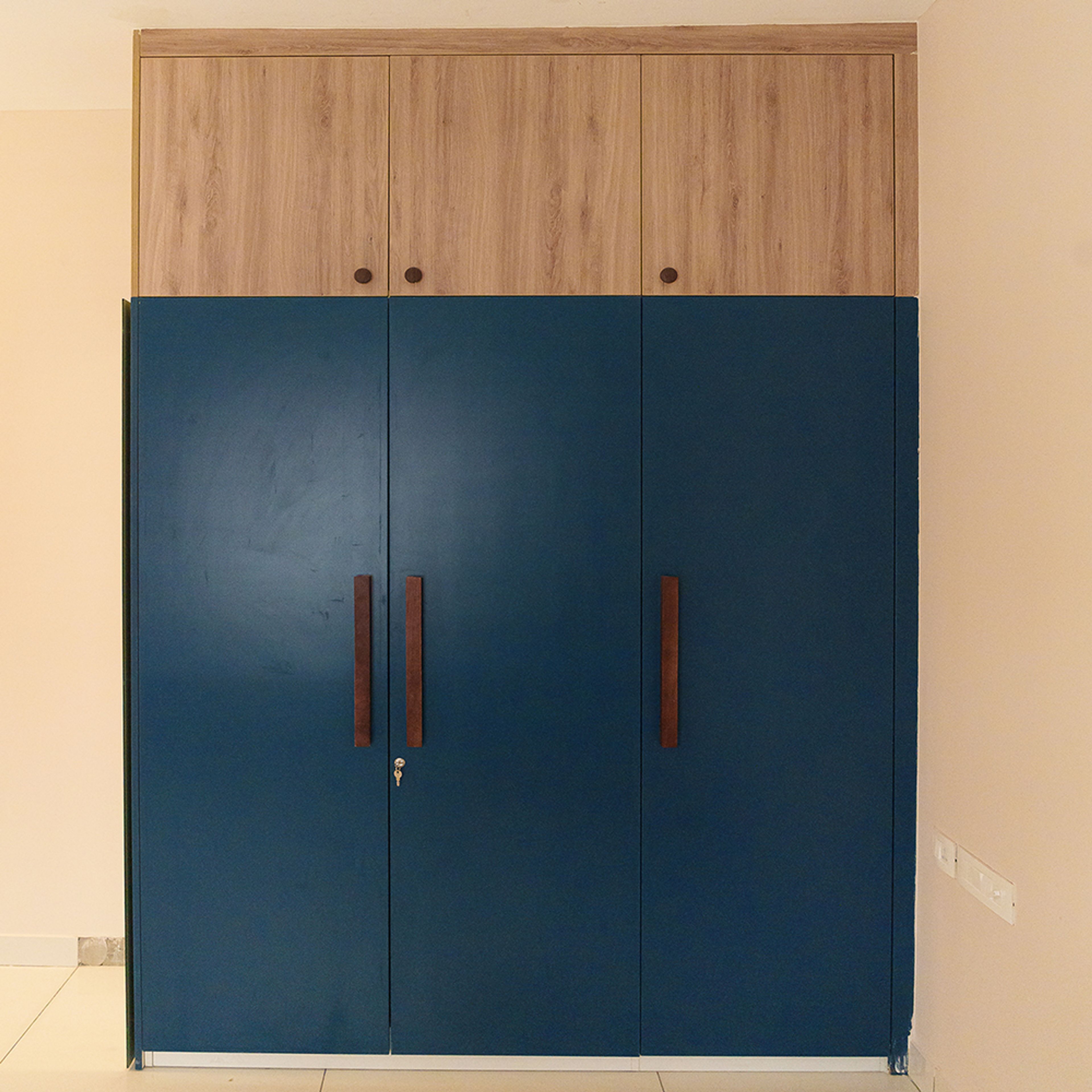 3-Door Blue Swing Wardrobe Design with Wooden Loft Unit