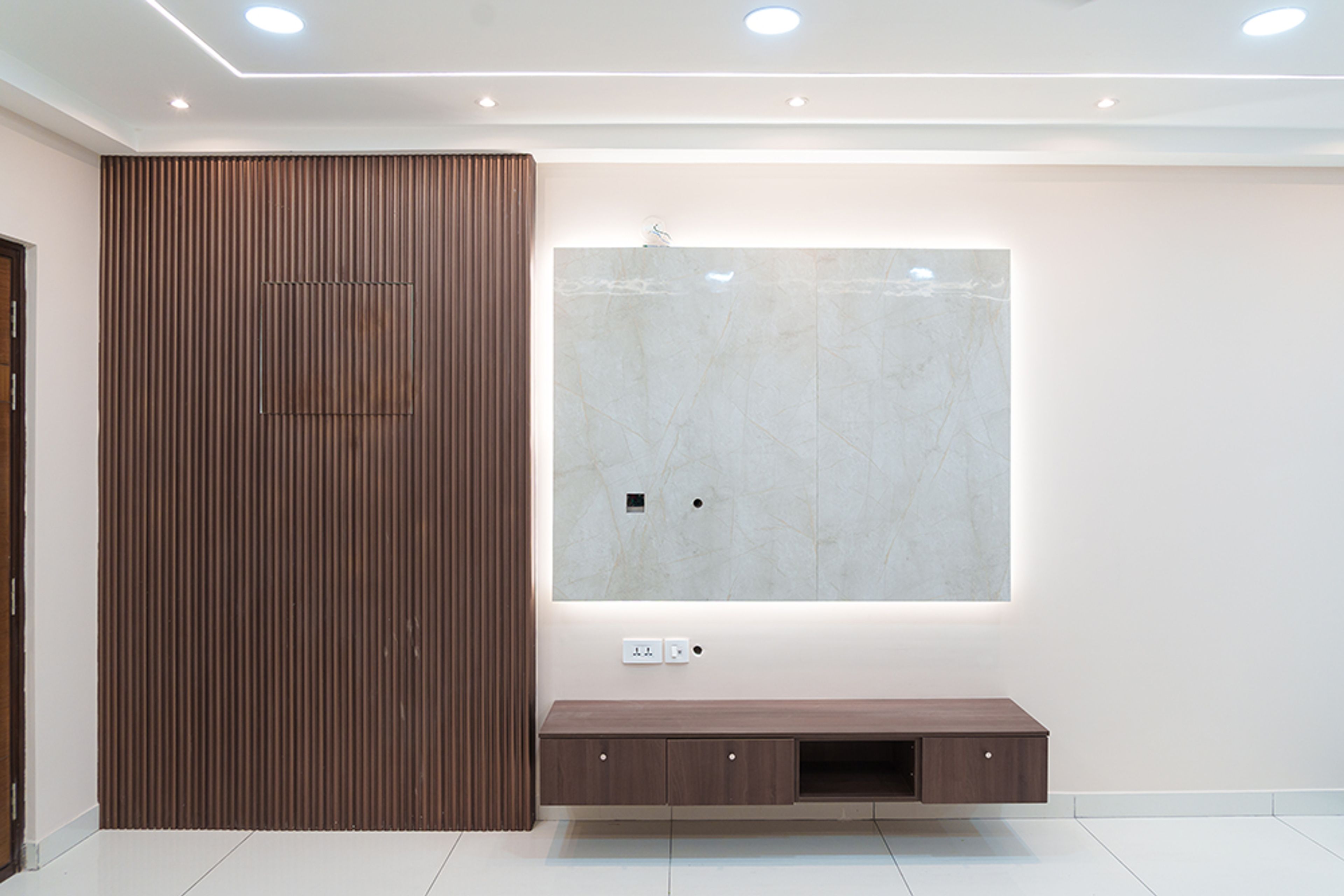 TV Unit Design with Wooden Slats Wall and White Marble Patterned Backsplash
