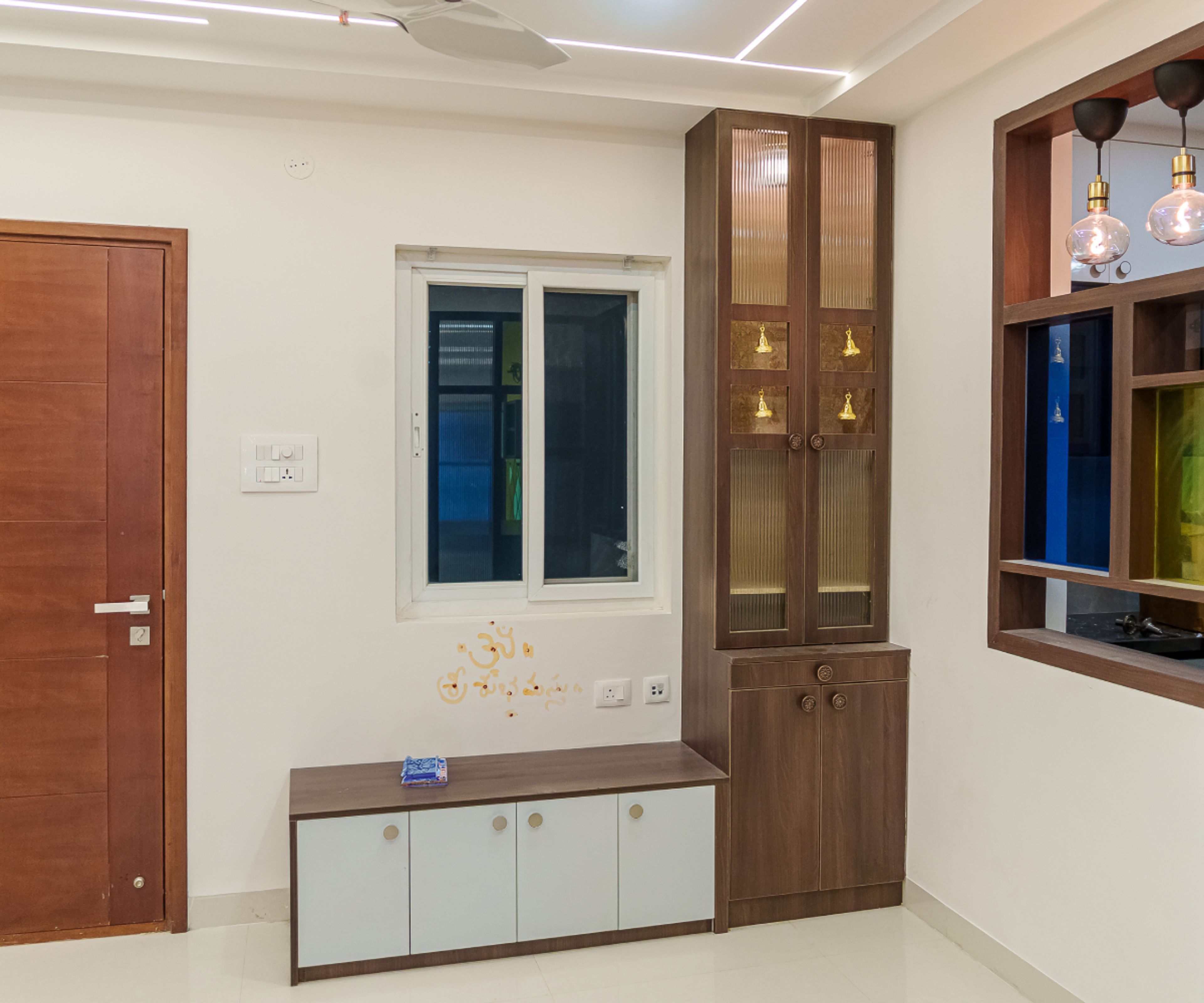 Wooden Pooja Unit Design With Frosted Glass Doors and White Storage Bench