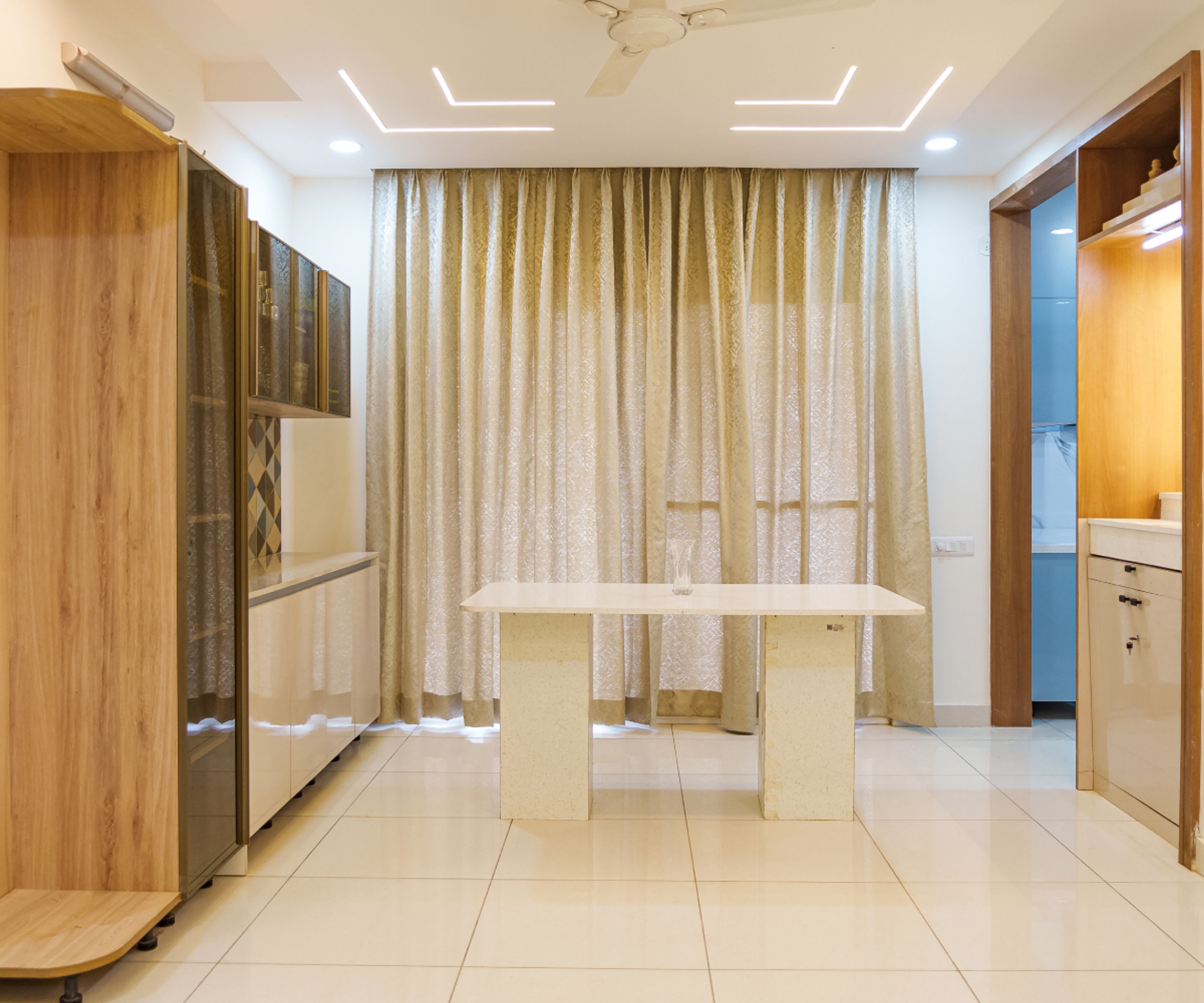 Dining Room Design with Marble Top Table, Wall and Tall Units
