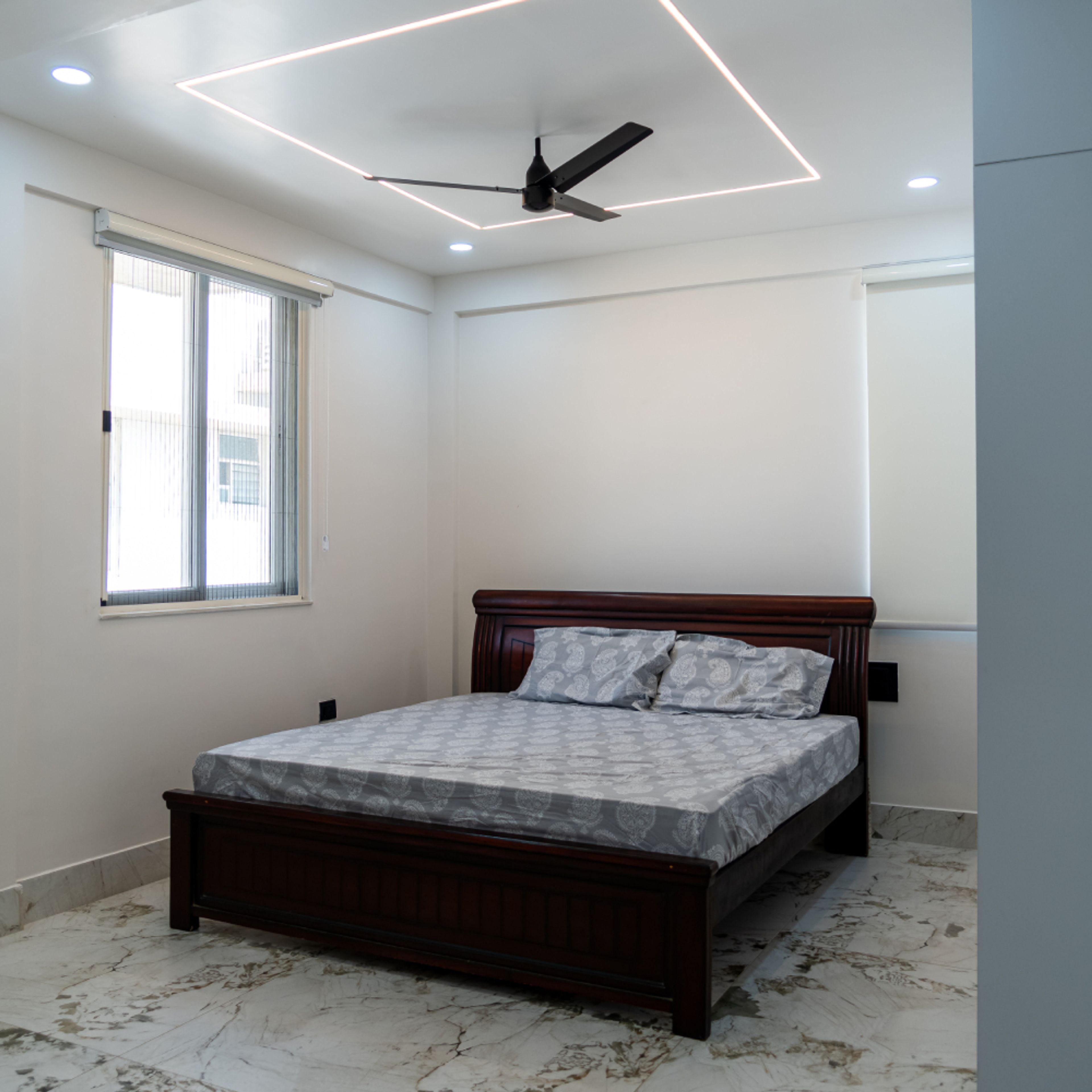 Guest Bedroom Design with White Walls, Cove Lights and Spotlights