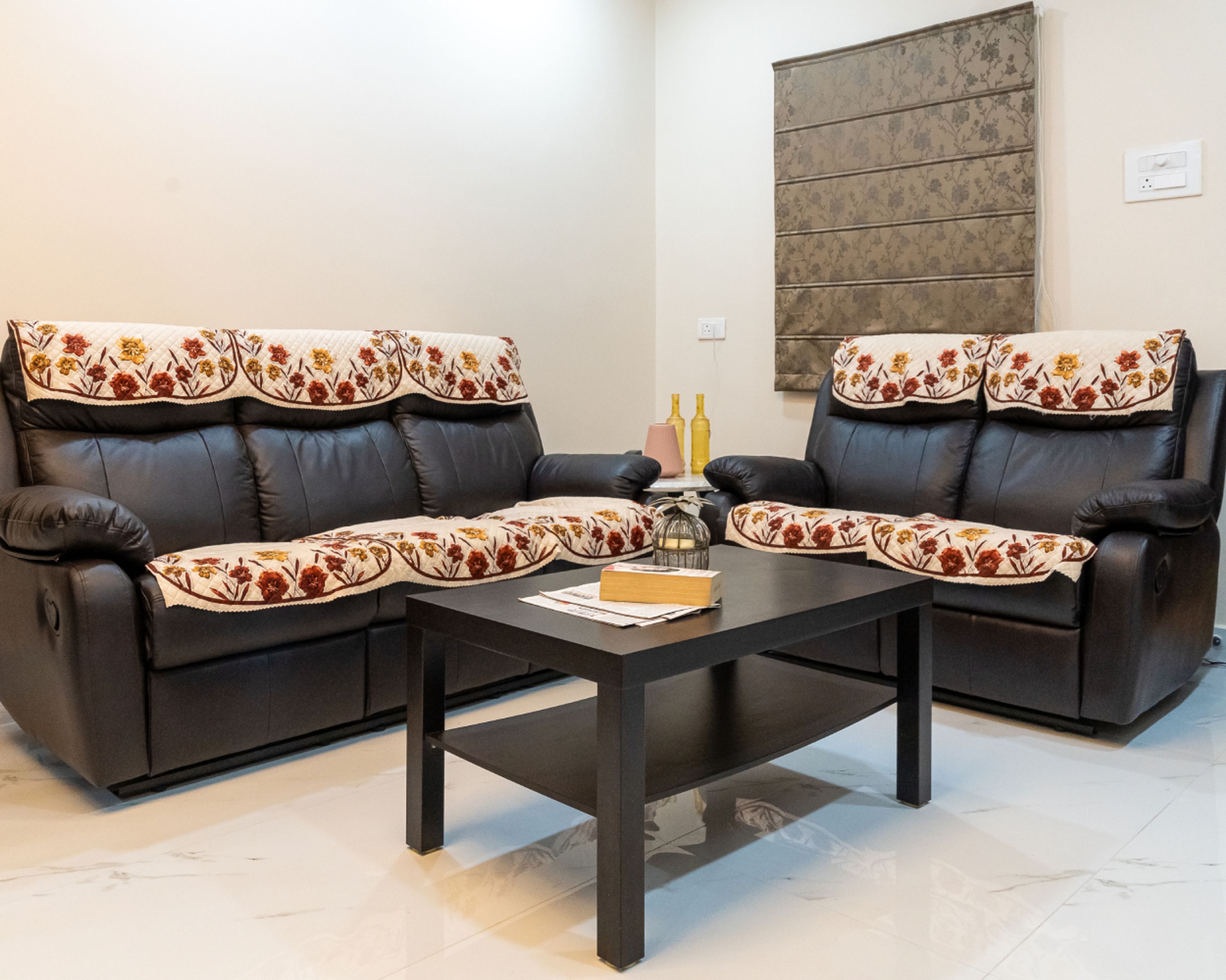 Living Room Design with Black Leather Sofas and Wooden Coffee Table