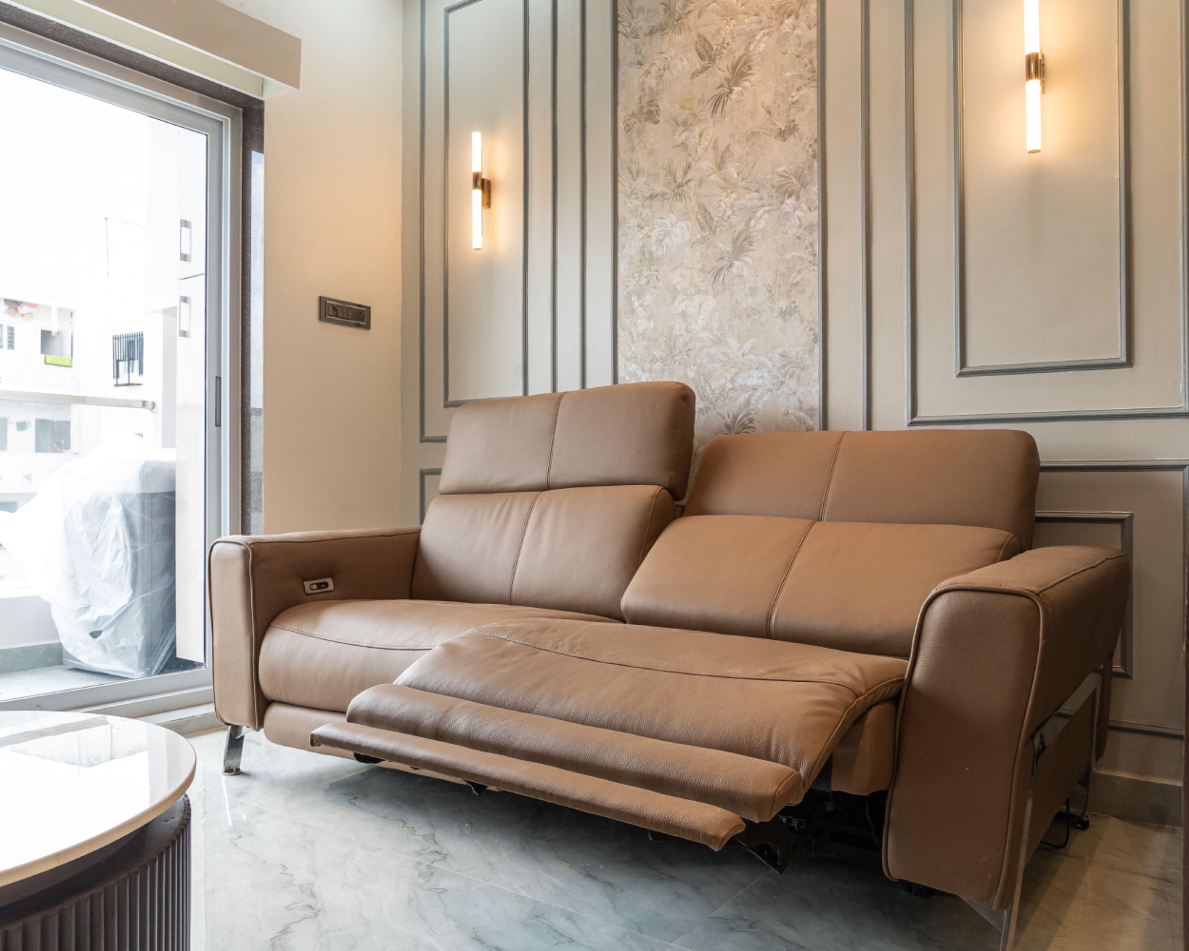 Living Room Design with 2-Seater Recliner Brown Leather Sofa and Tropical Themed Beige Wallpaper with Grey Trims