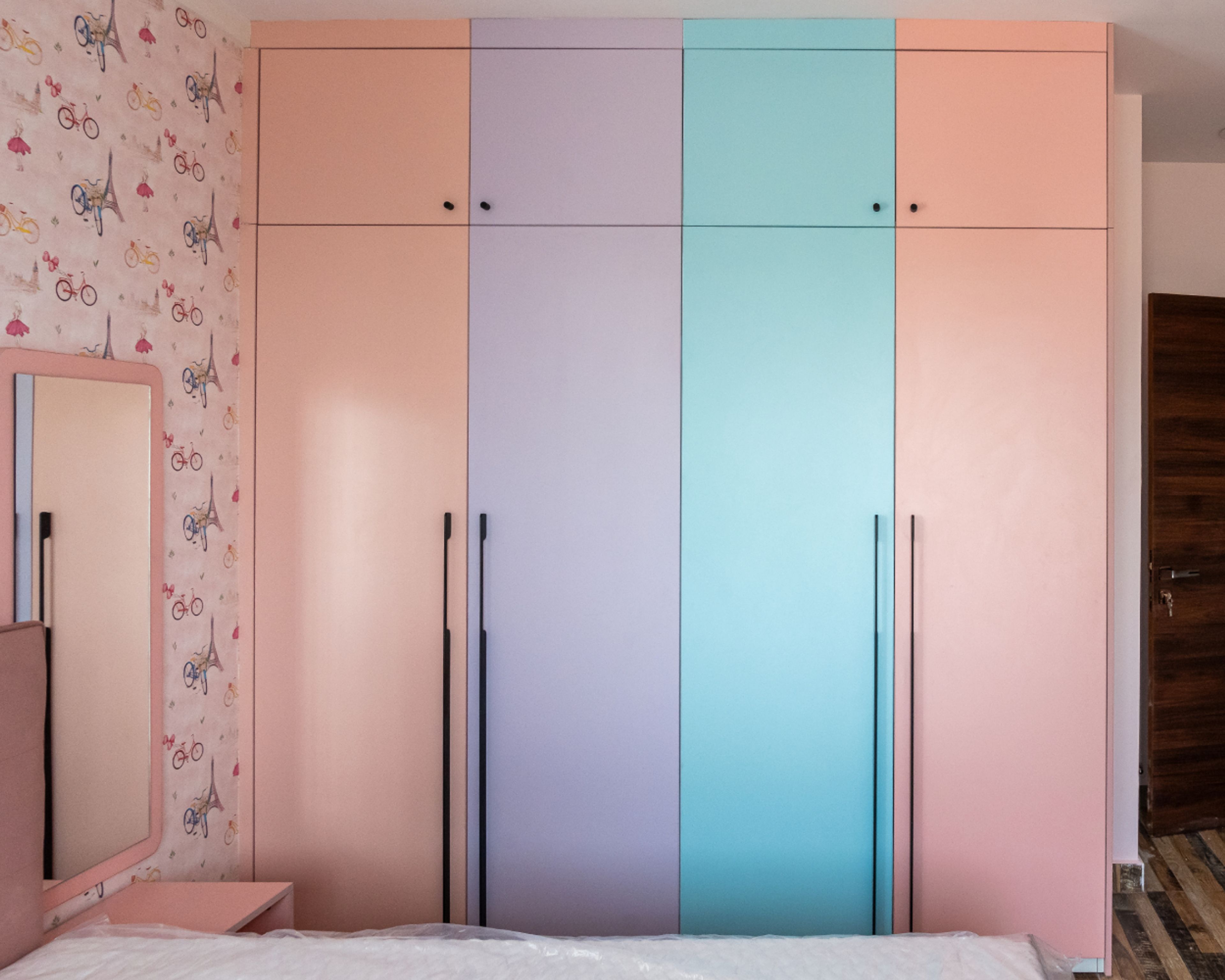 4-Door Pastel Pink, Peach, Lavender and Blue Coloured Swing Wardrobe Design with Loft Unit