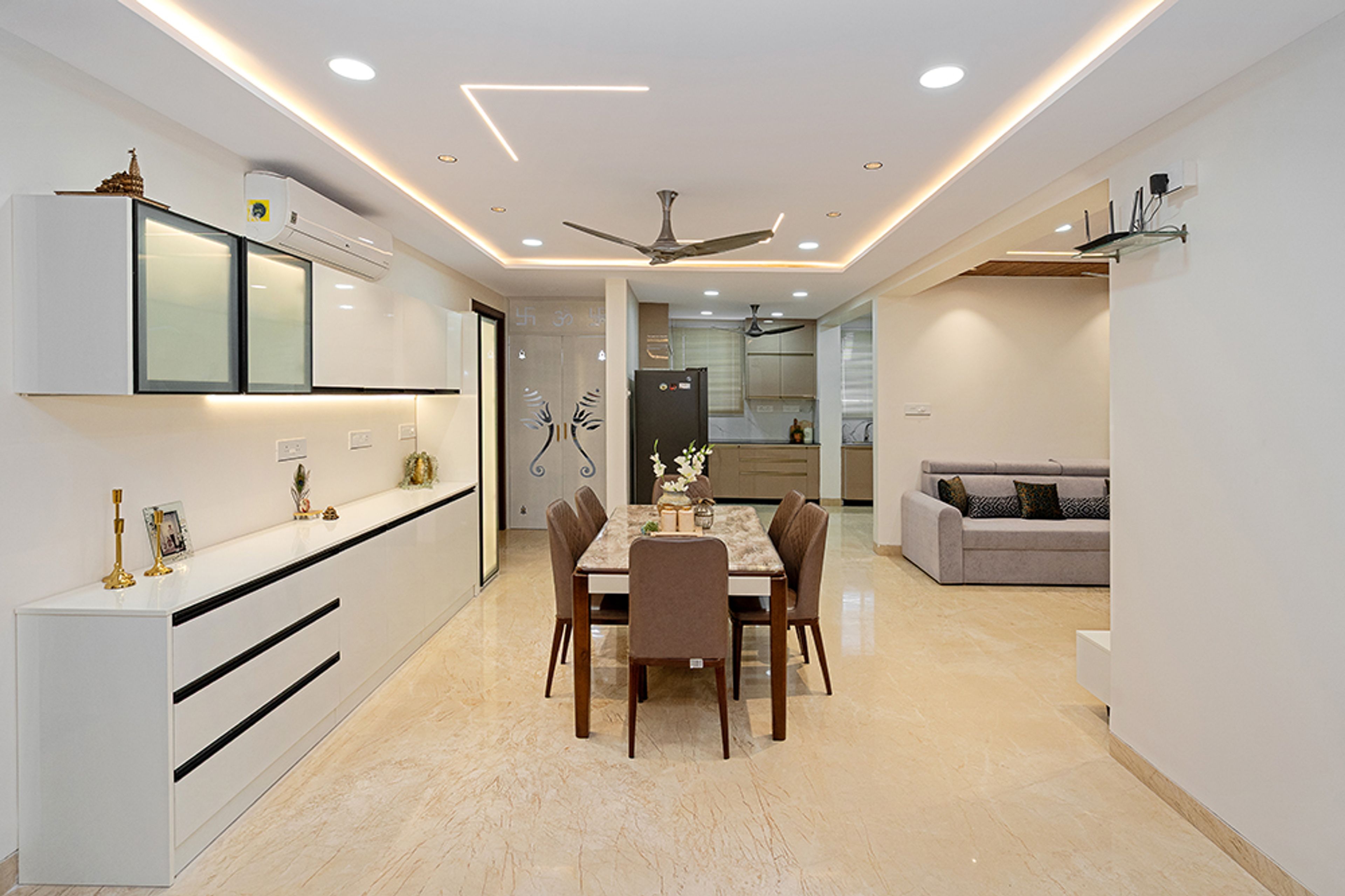 6-Seater Dining Room Design with White Crockery Unit, Grey Chairs and Marble Top Table