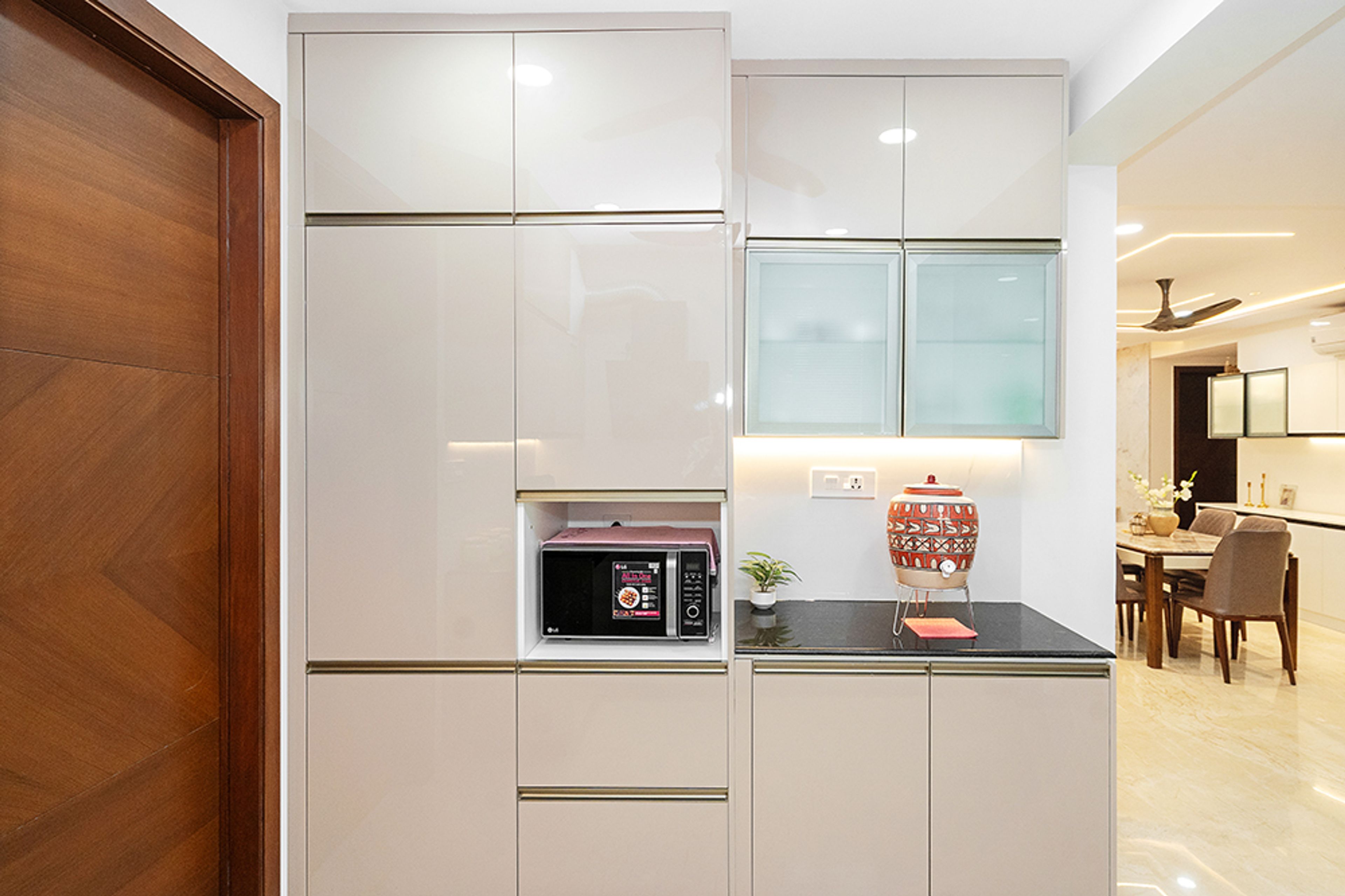 Crockery Unit Design with Beige Units and Granite Countertop