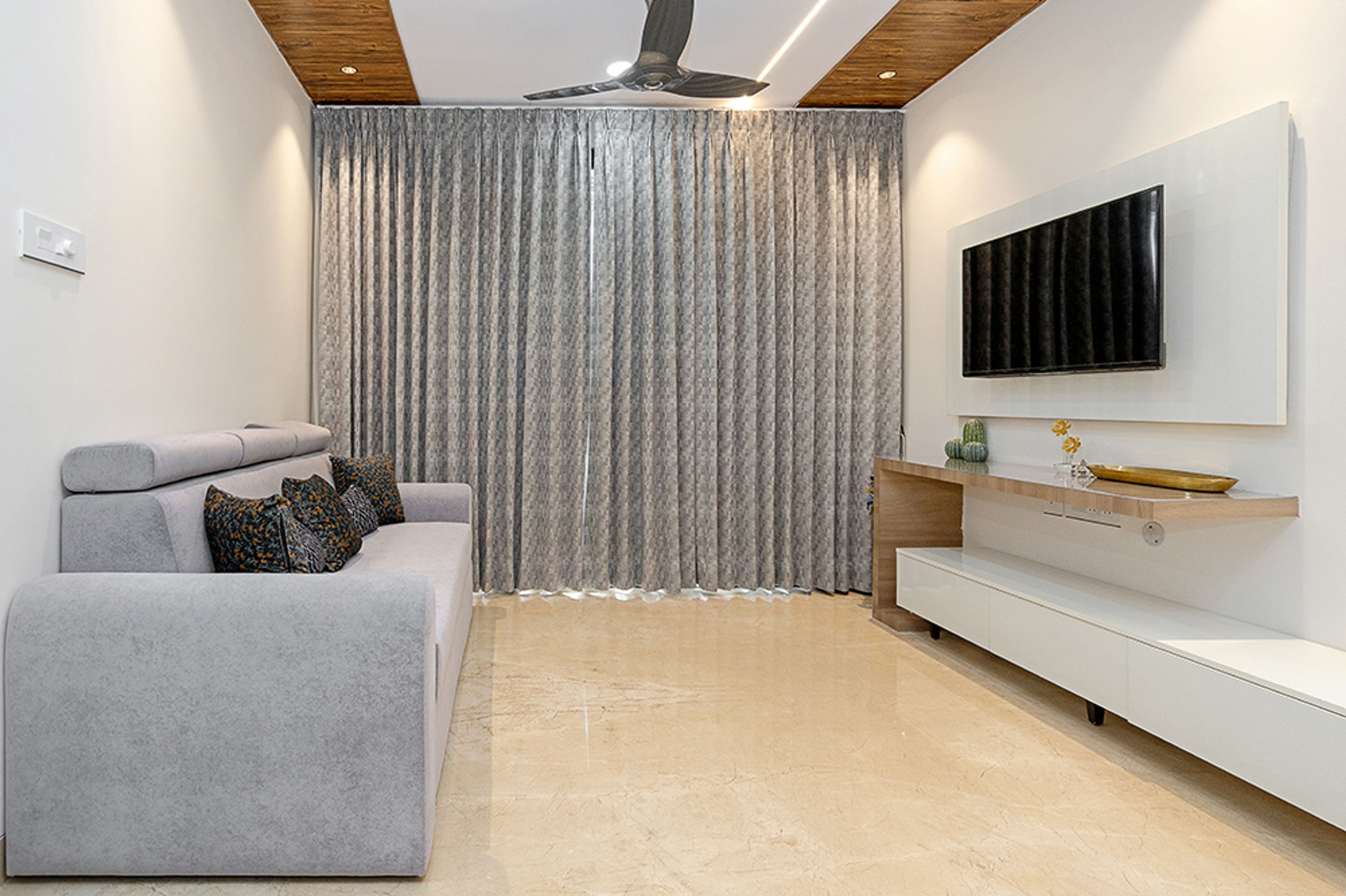 Living Room Design with Grey Sofa and White TV Unit