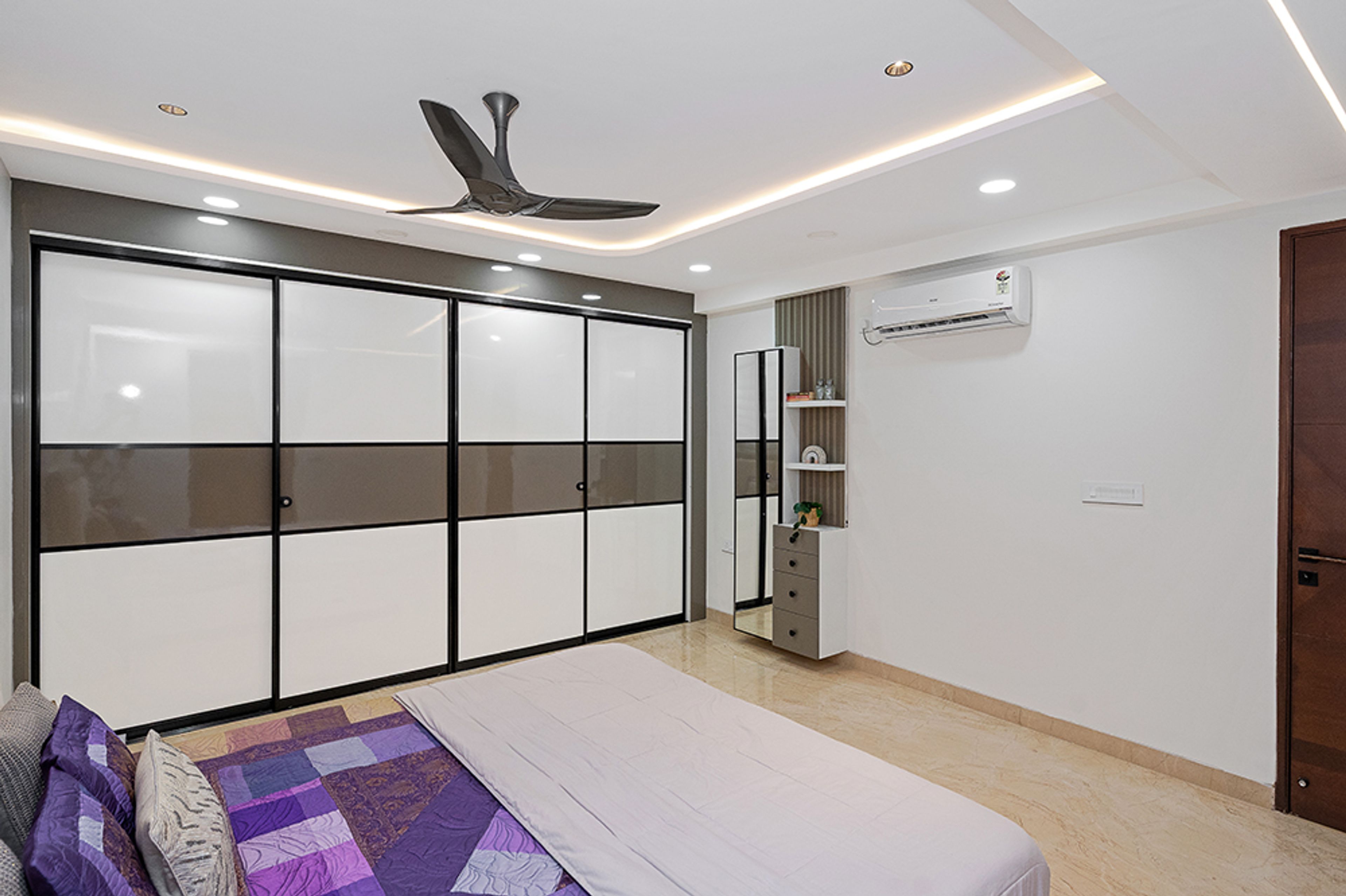 Bedroom Design with White and Brown 4-Door Sliding Wardrobe